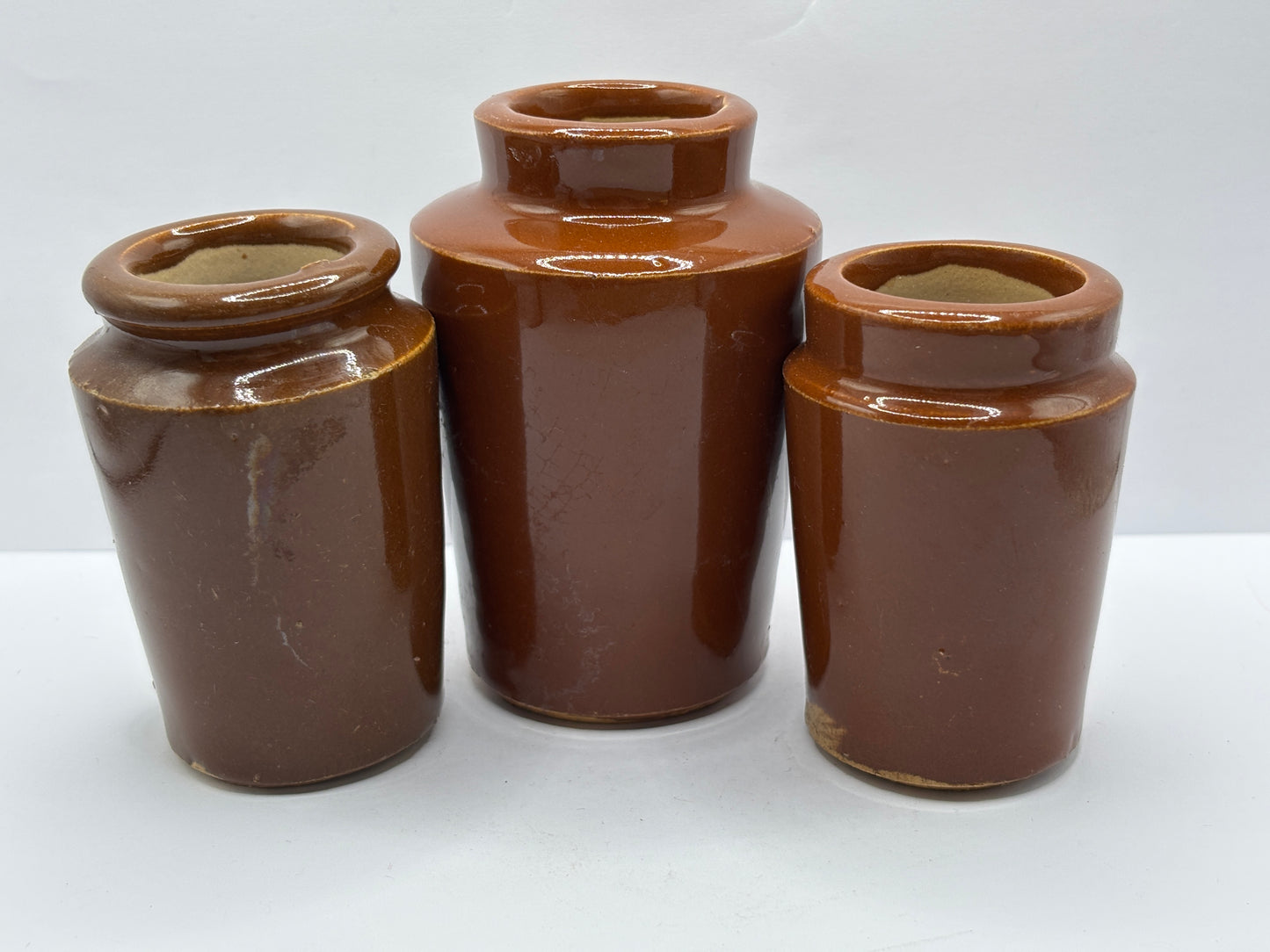 3 old brown stoneware cream pots