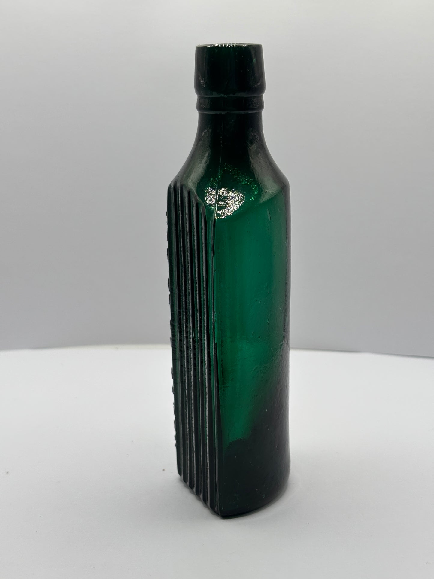 Old green glass poison bottle, not to be taken