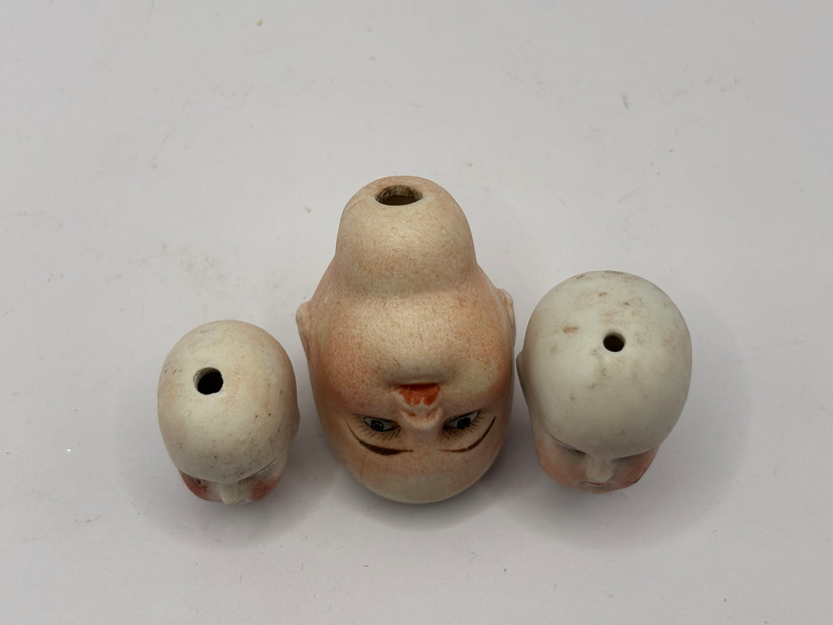 3 Old small bisque dolls heads