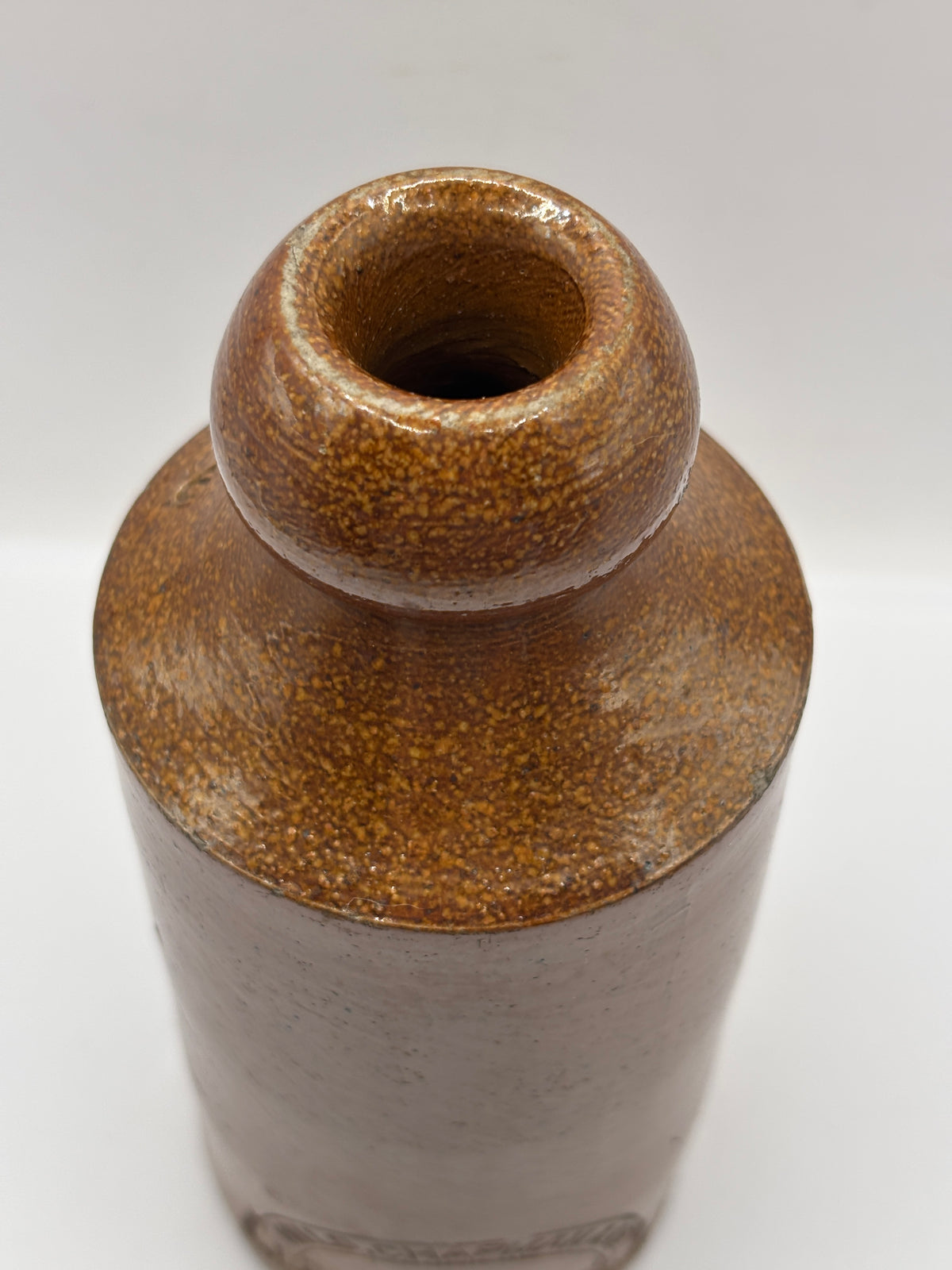 Old impressed stoneware ginger beer bottle, London. Hills chapman & co