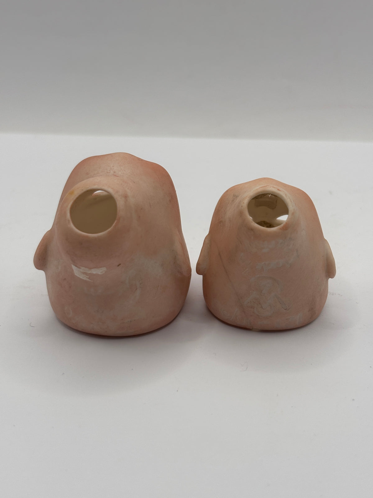 2 Old small bisque dolls heads. Damaged