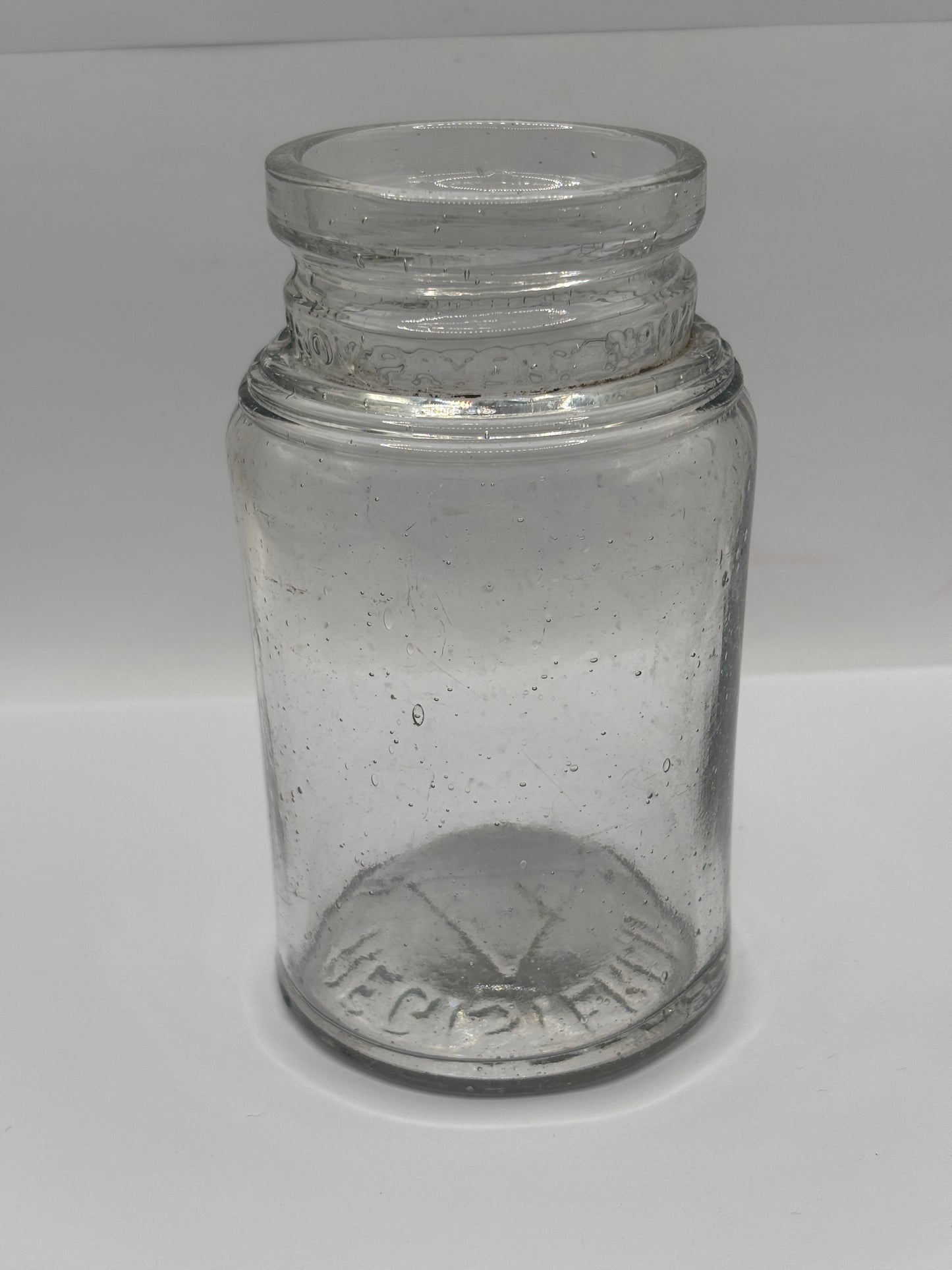 Old clear glass pickle jar