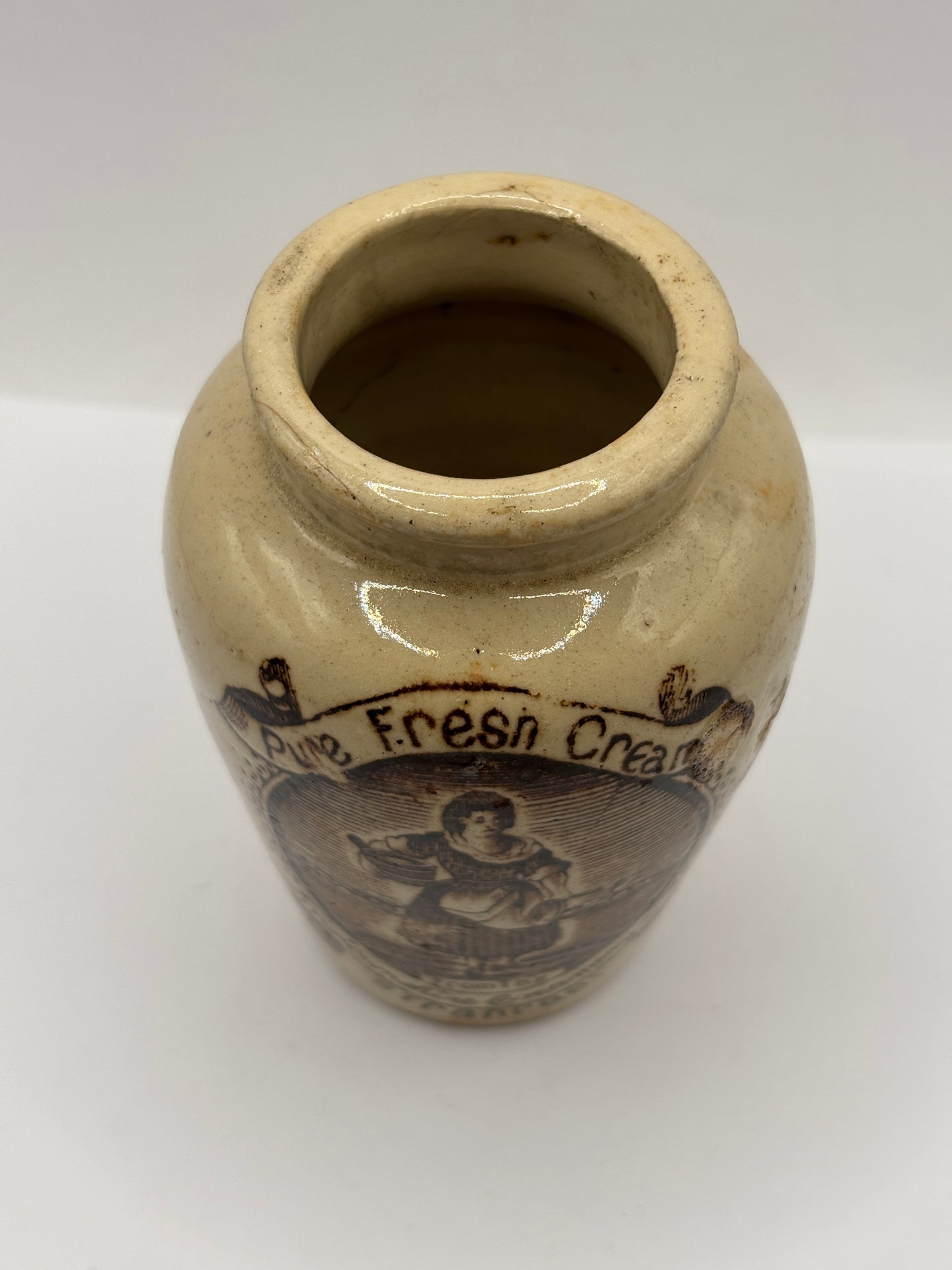 Old stoneware advertising cream pot, pure fresh cream Stranraer. Serpia print