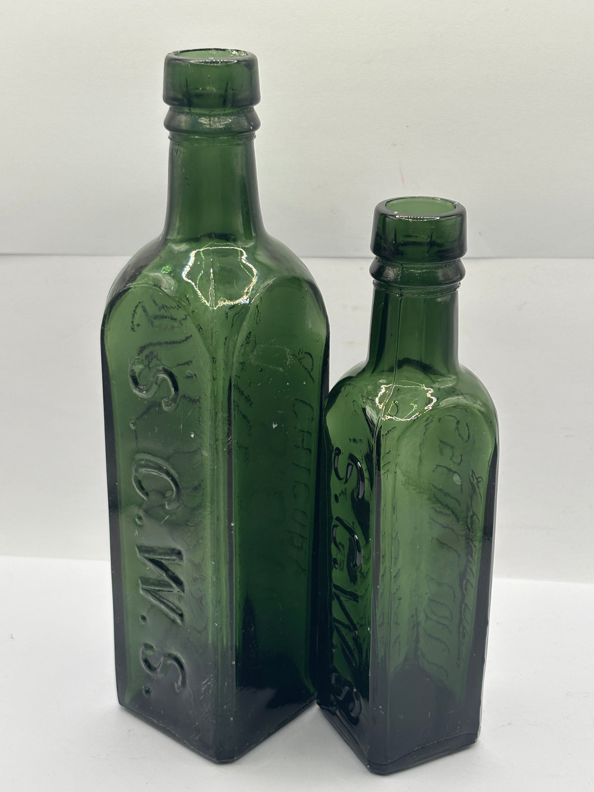 2 Old green glass essence of coffee bottles