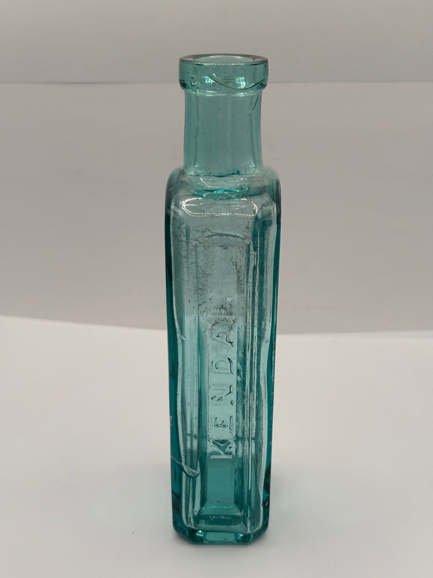 Old advertising aqua glass chemist bottle, Whittakers colour works