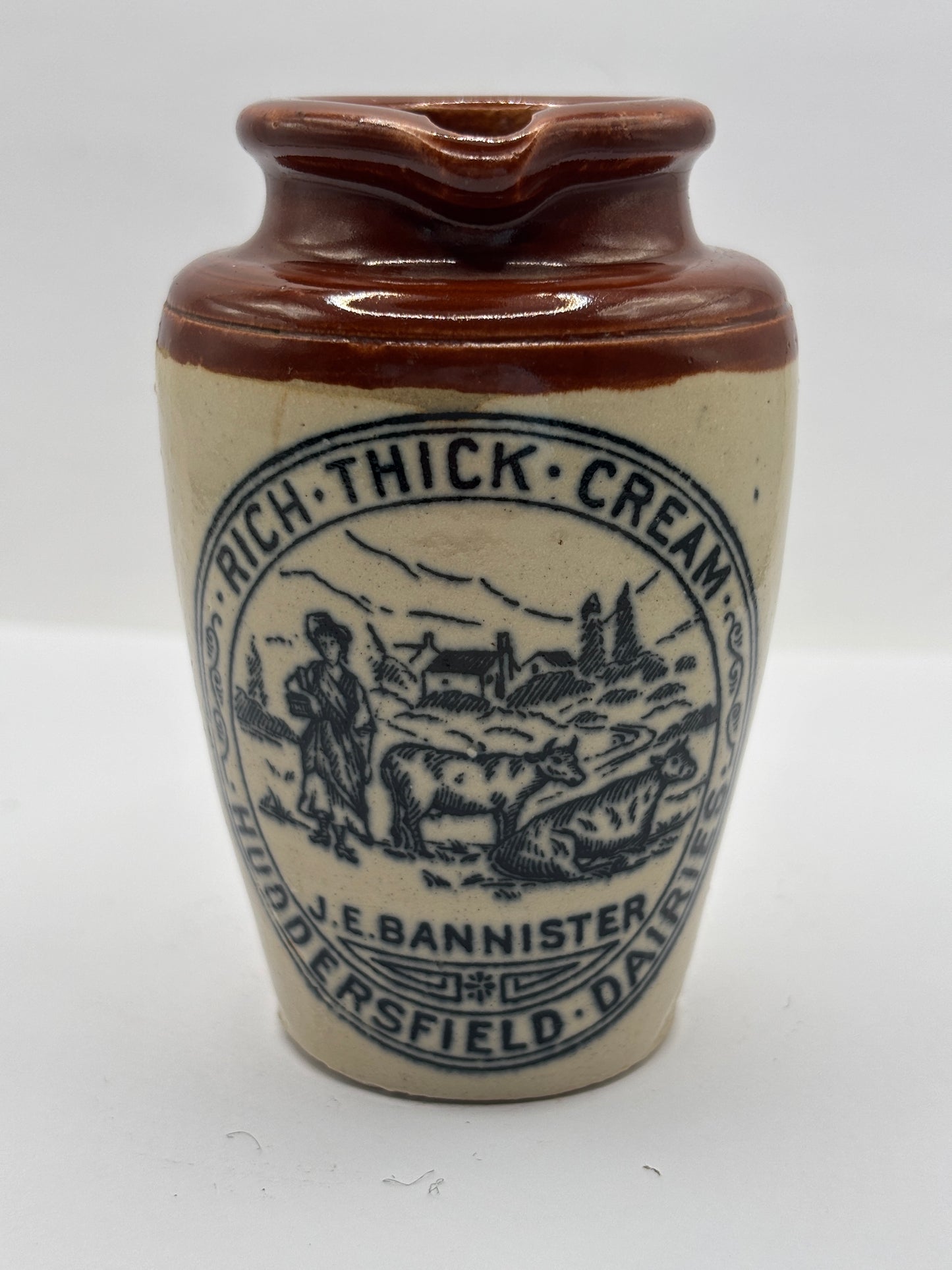 Old advertising cream pot, Bannisters Huddersfield. Damaged
