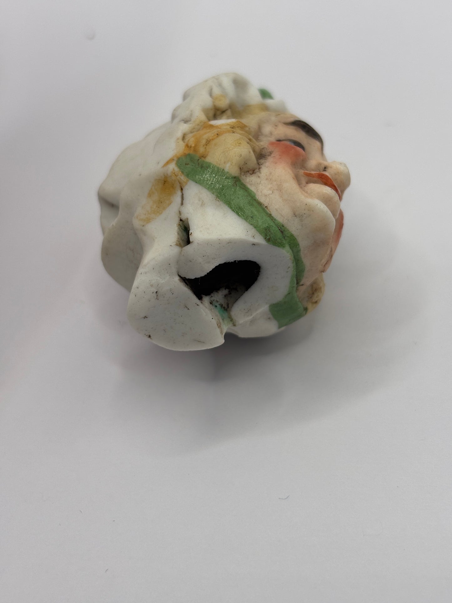 Old dolls head, damaged