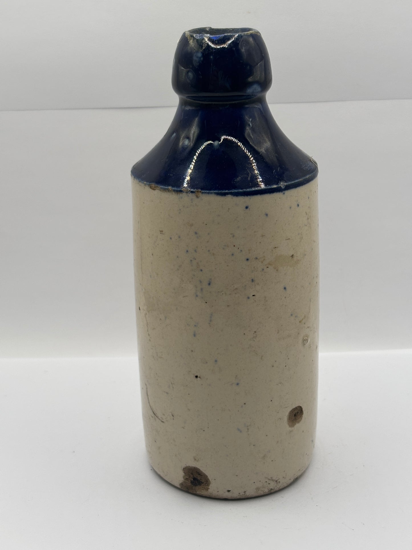 Old blue top stoneware ginger beer bottle, E.E Bevan Neath Brewery