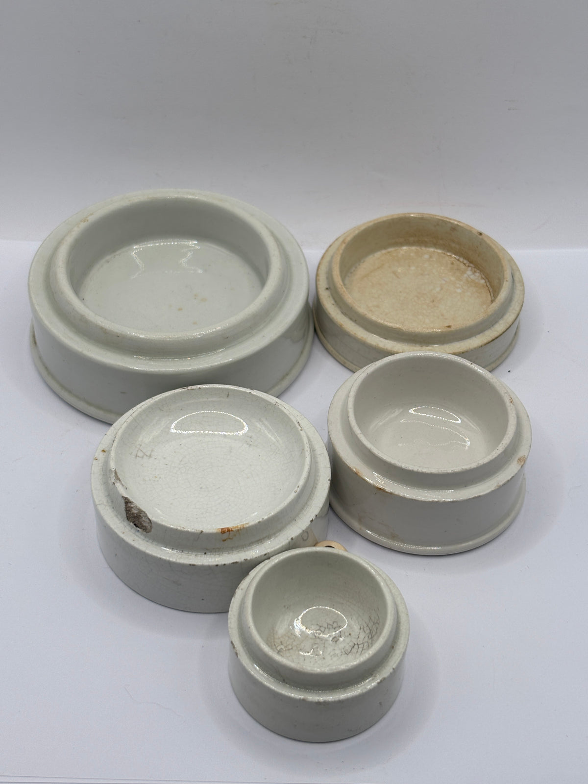 5 old stoneware pot lid bases, stackers (G)