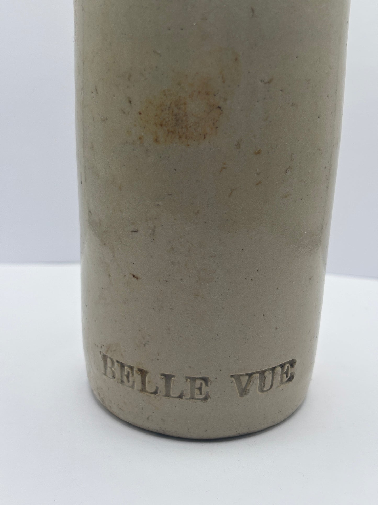Old white stoneware Belle vue ginger beer bottle