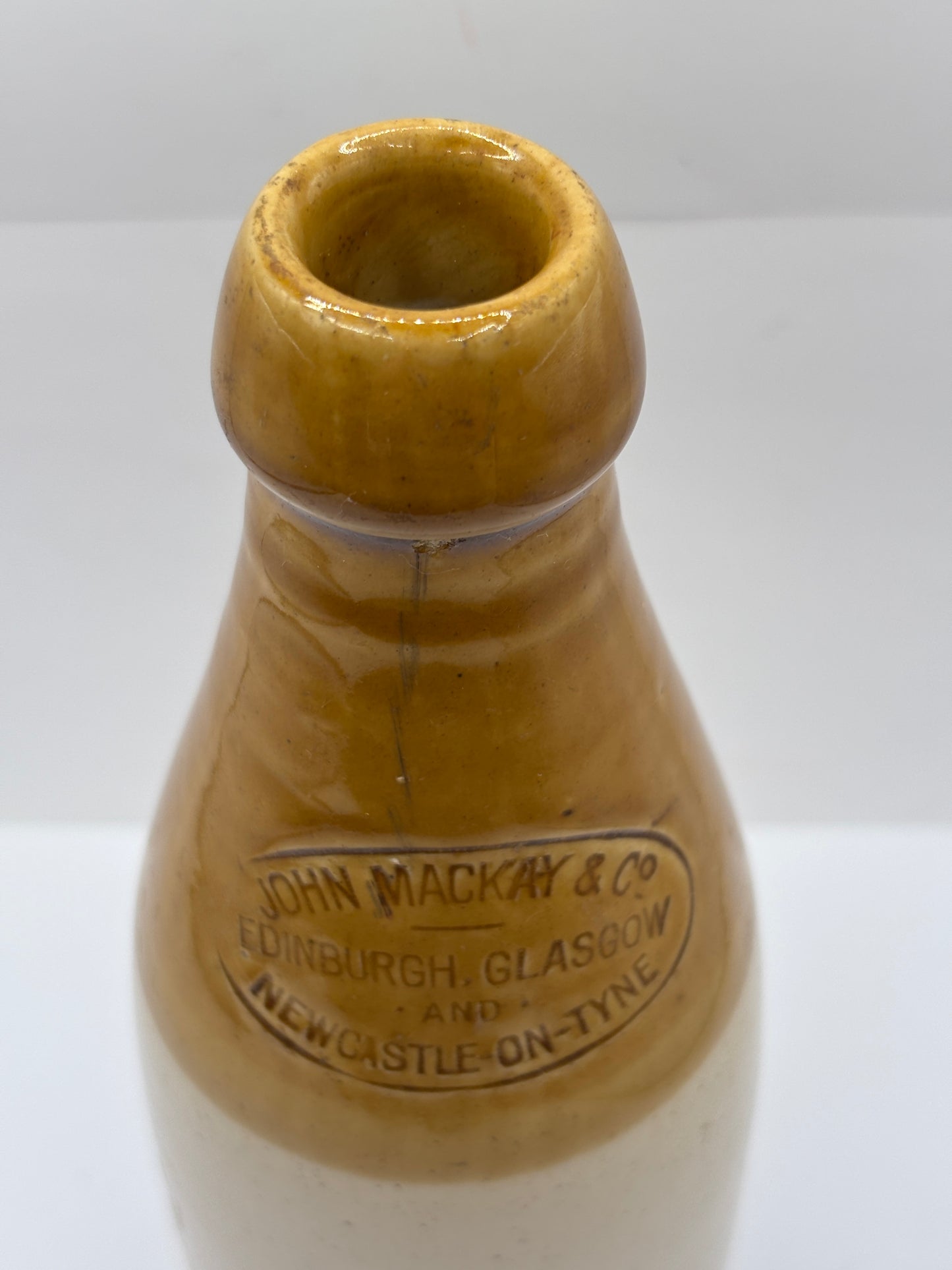Old stoneware stout bottle, John Mackay & Co