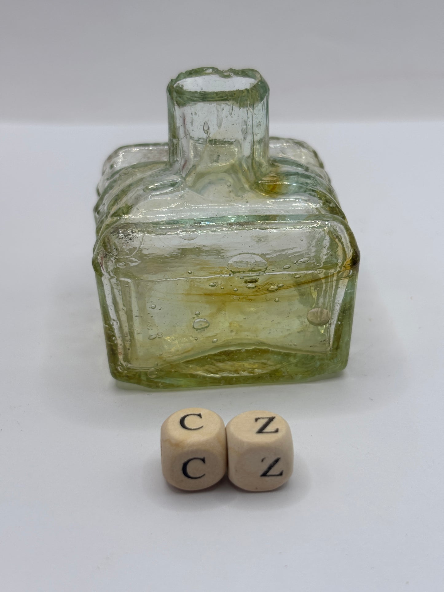 Old glass inkwell with swirls, penny ink, ink bottle (cz)