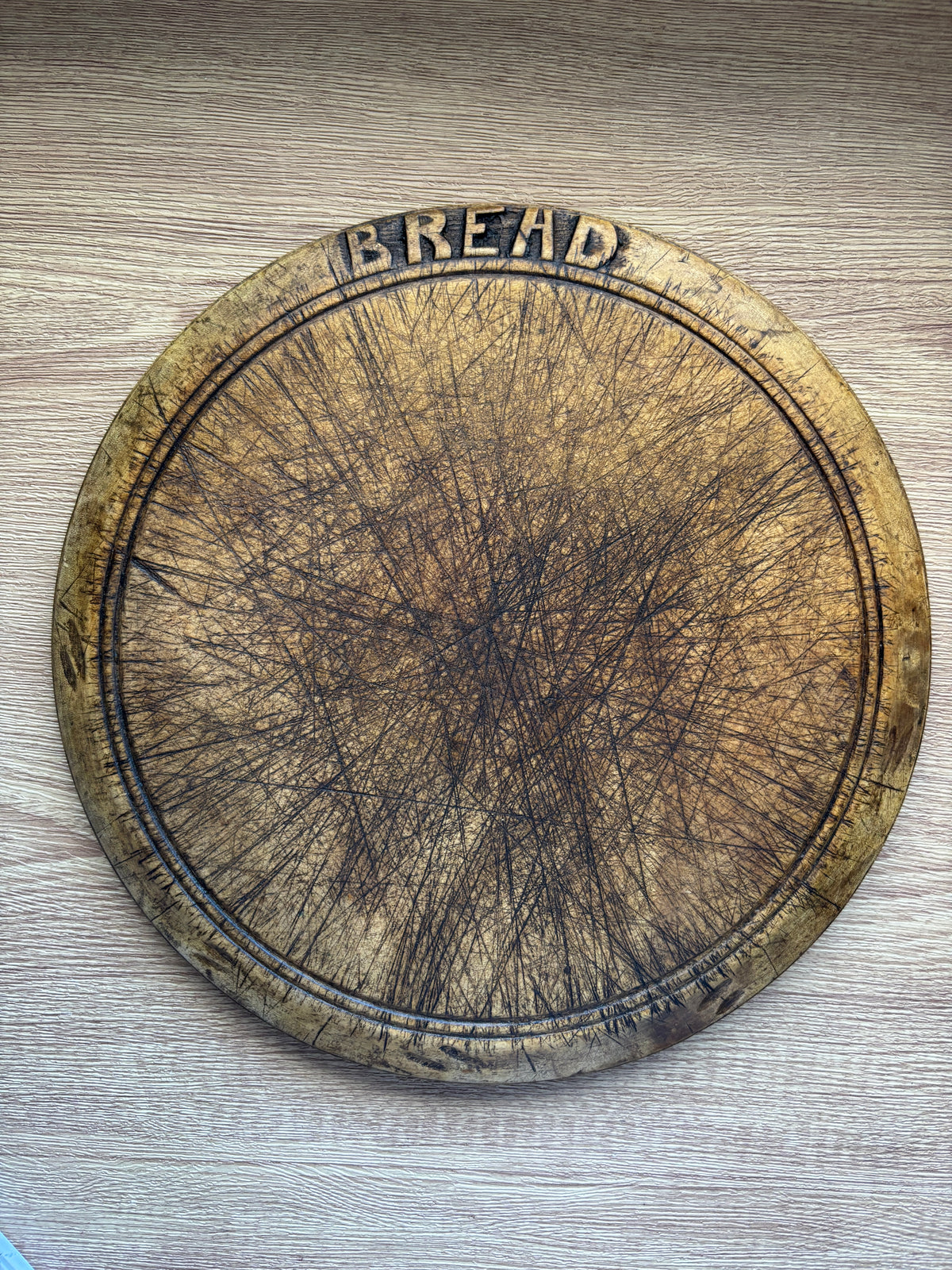 Old wooden carved bread board