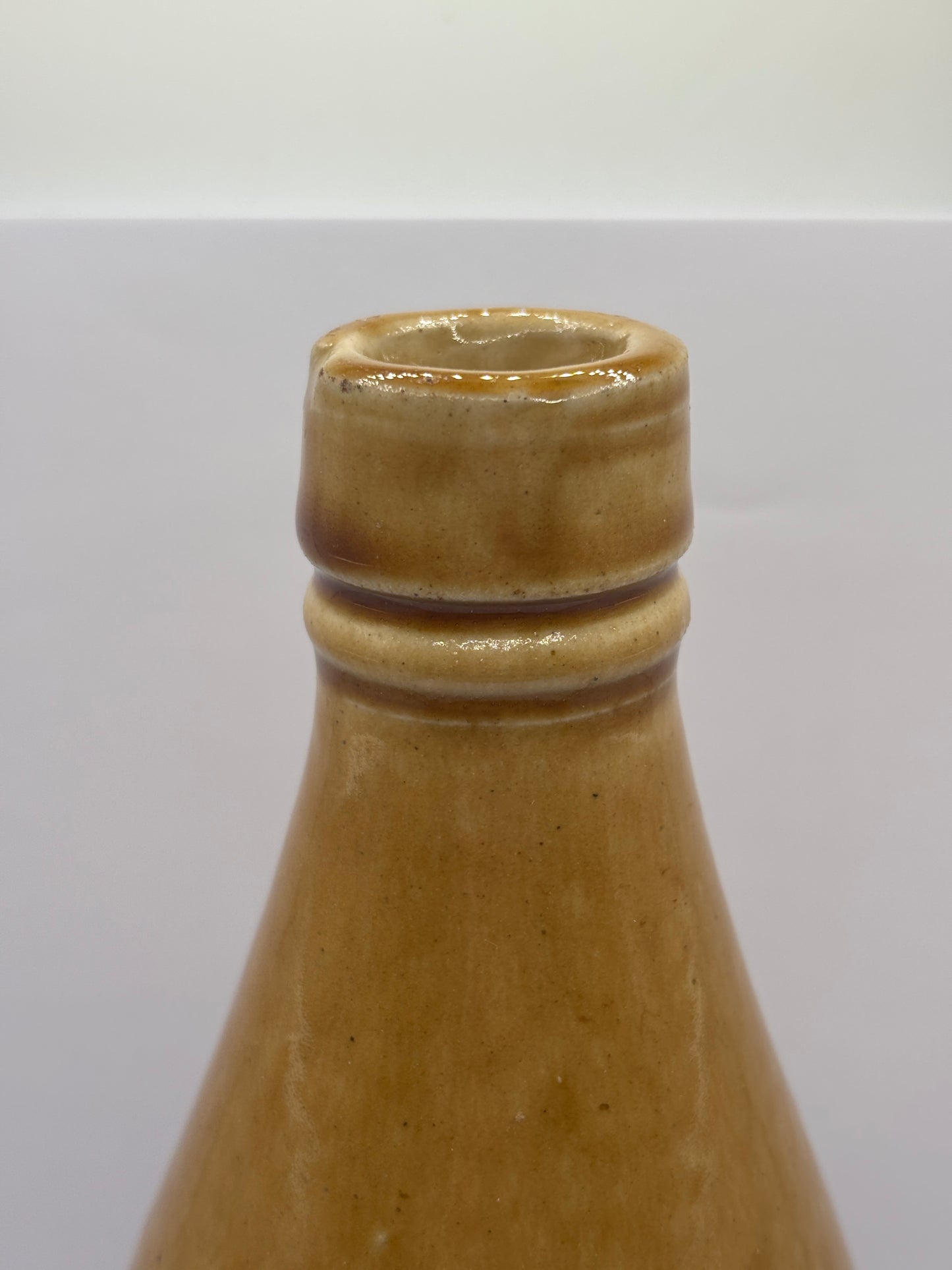 Old plain stoneware ginger beer bottle (c)