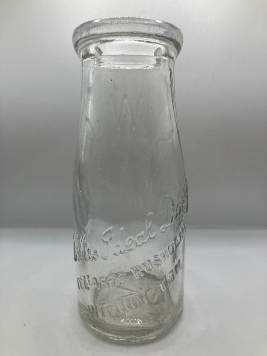 Advertising milk bottle, whites ideal dairy