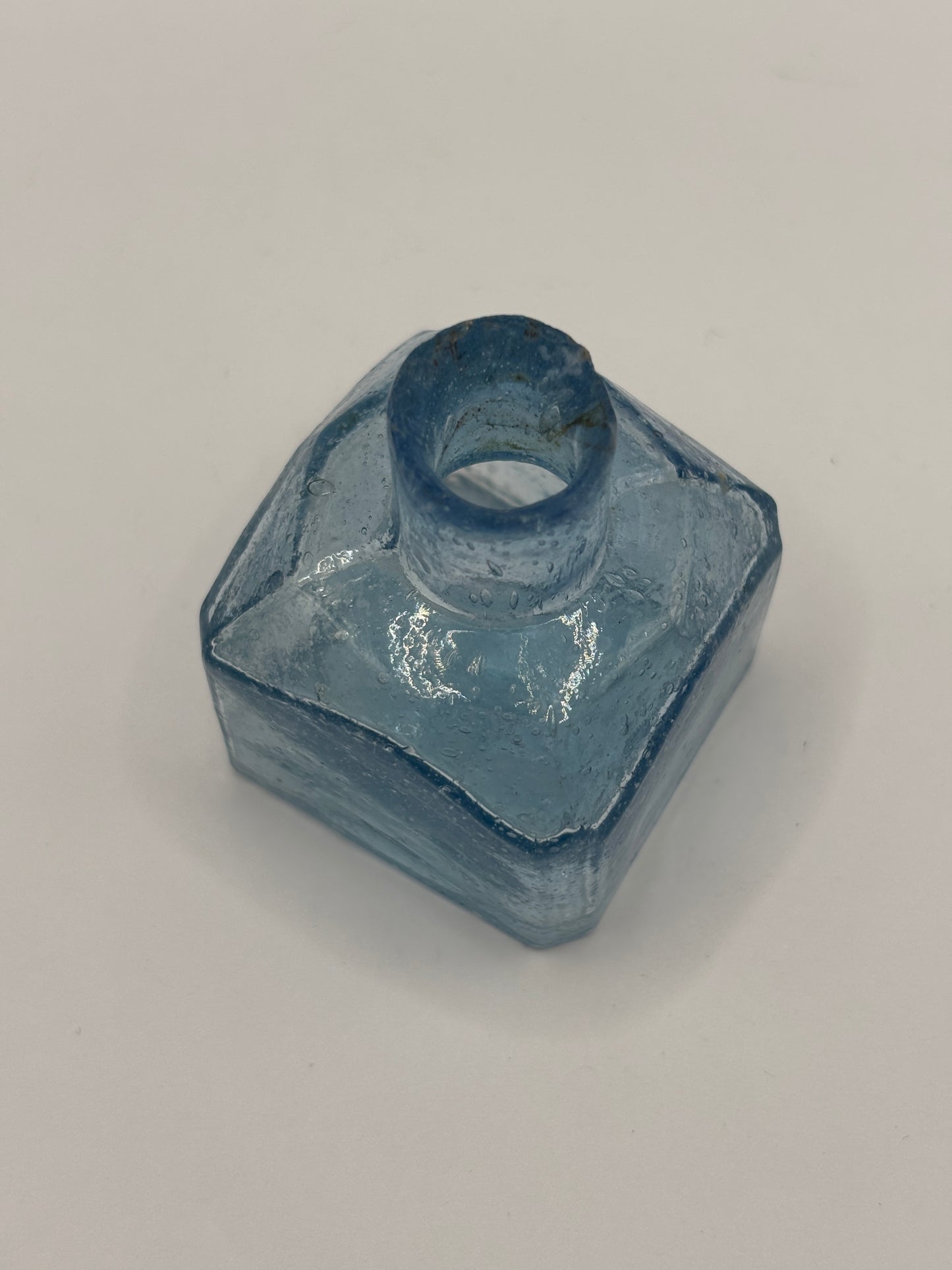 Old blue glass inkwell, ink bottle, penny ink. Lots of air bubbles