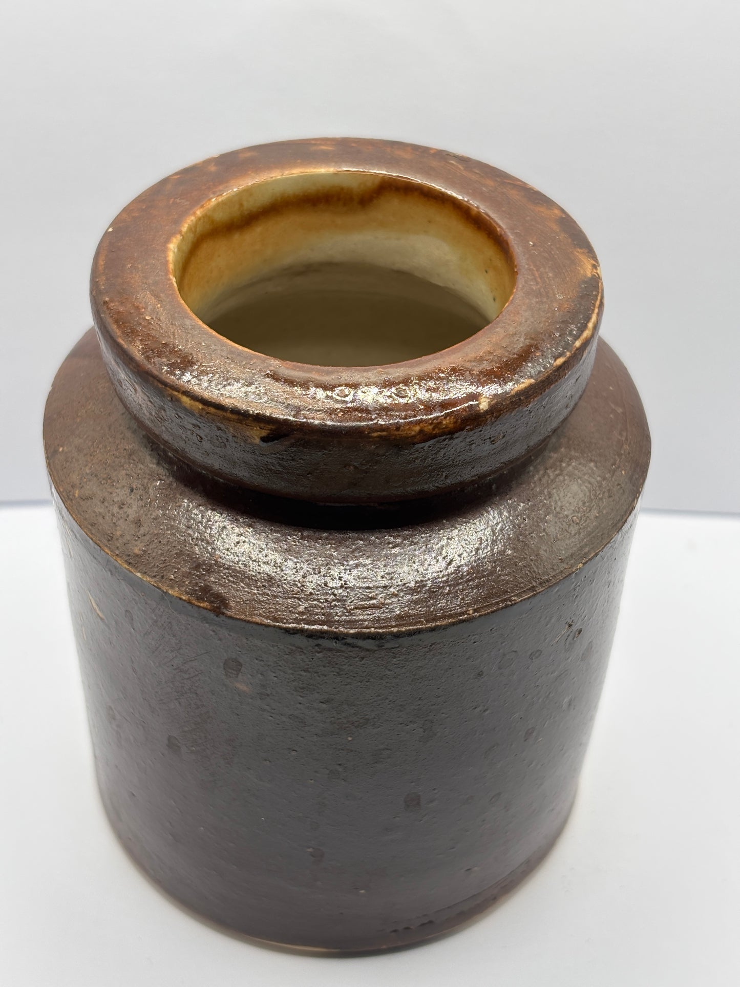 Old brown stoneware jar
