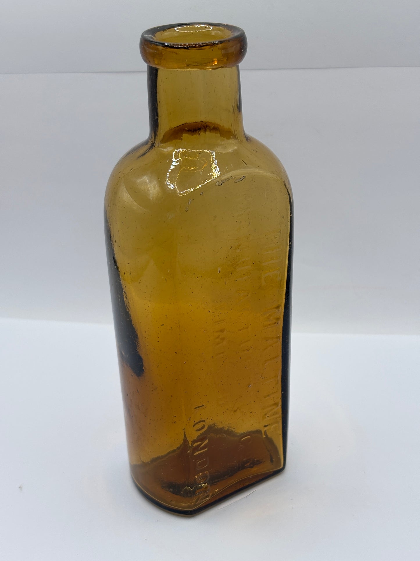 Old amber glass advertising chemist bottle, The Maltine manufacturing company
