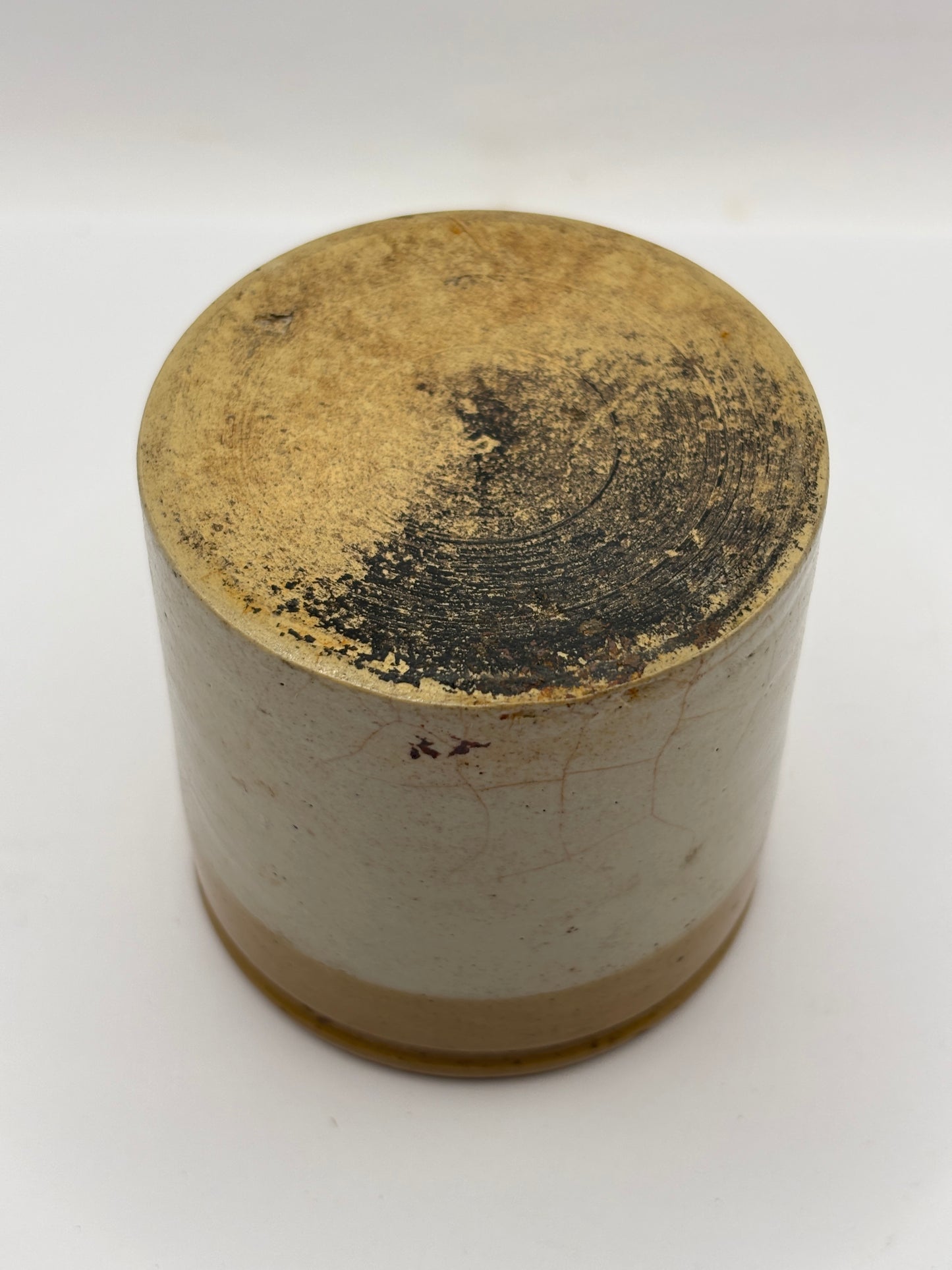 Old small brown top stoneware jar
