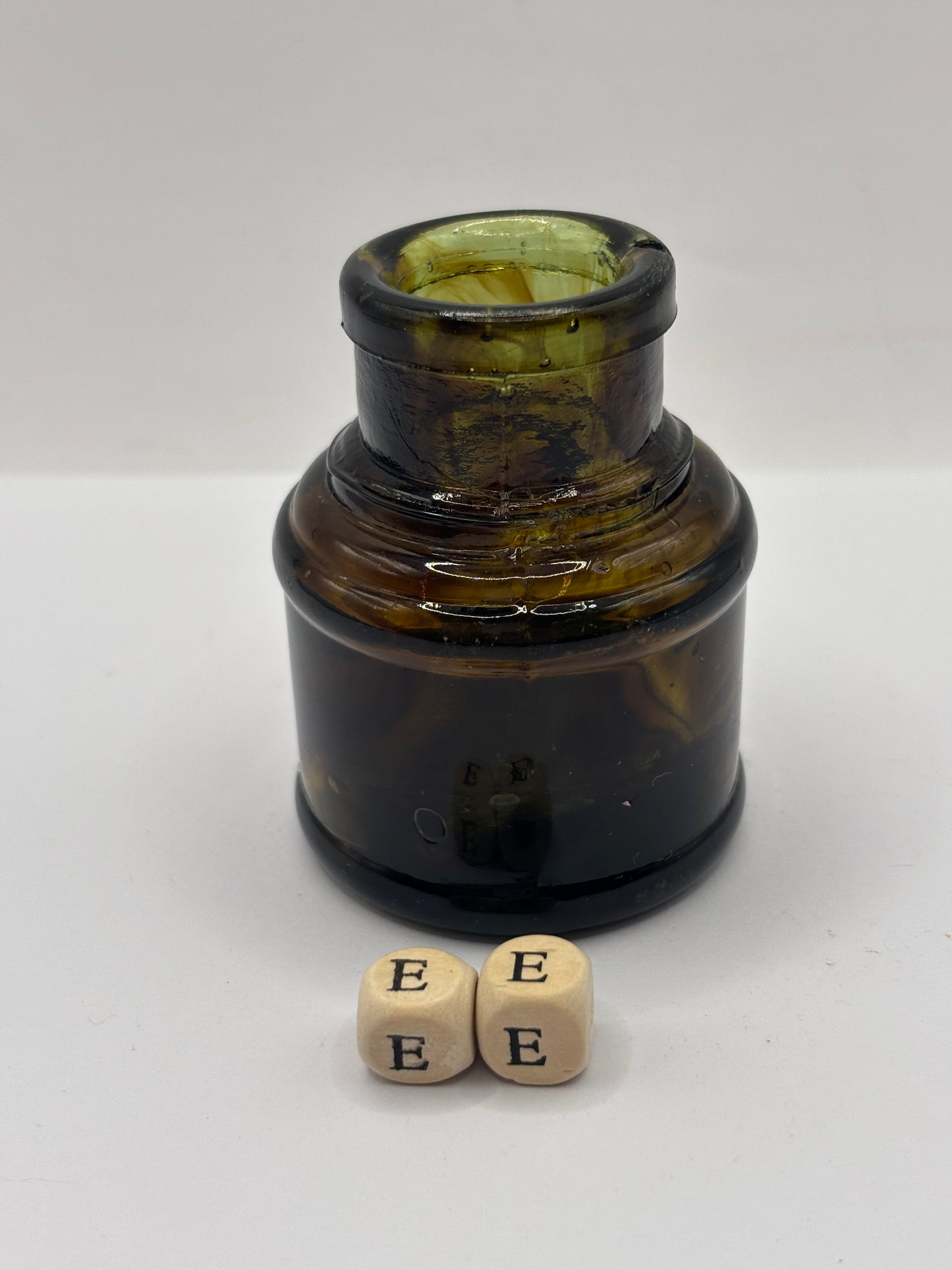 Old dark amber inkwell, ink bottle. Swirly (ee)