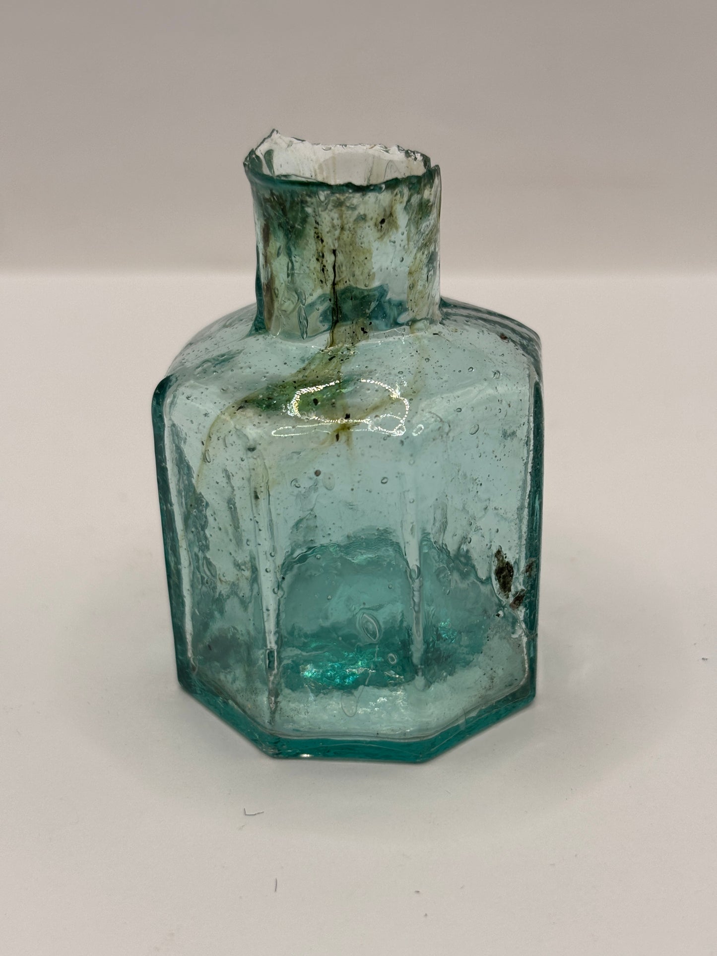 Old aqua glass inkwell with swirls, penny ink, ink bottle