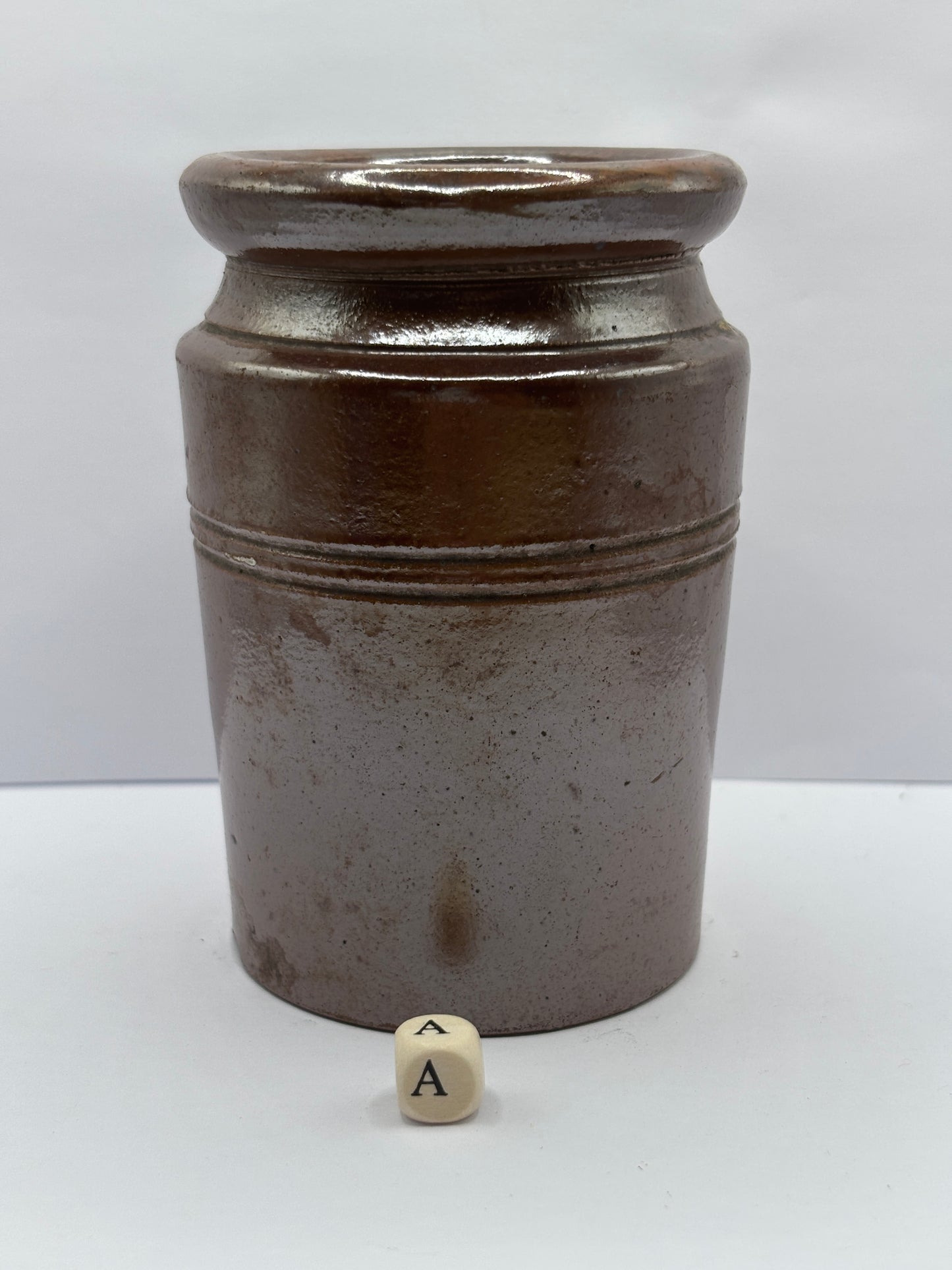 Old brown stoneware jar (a)