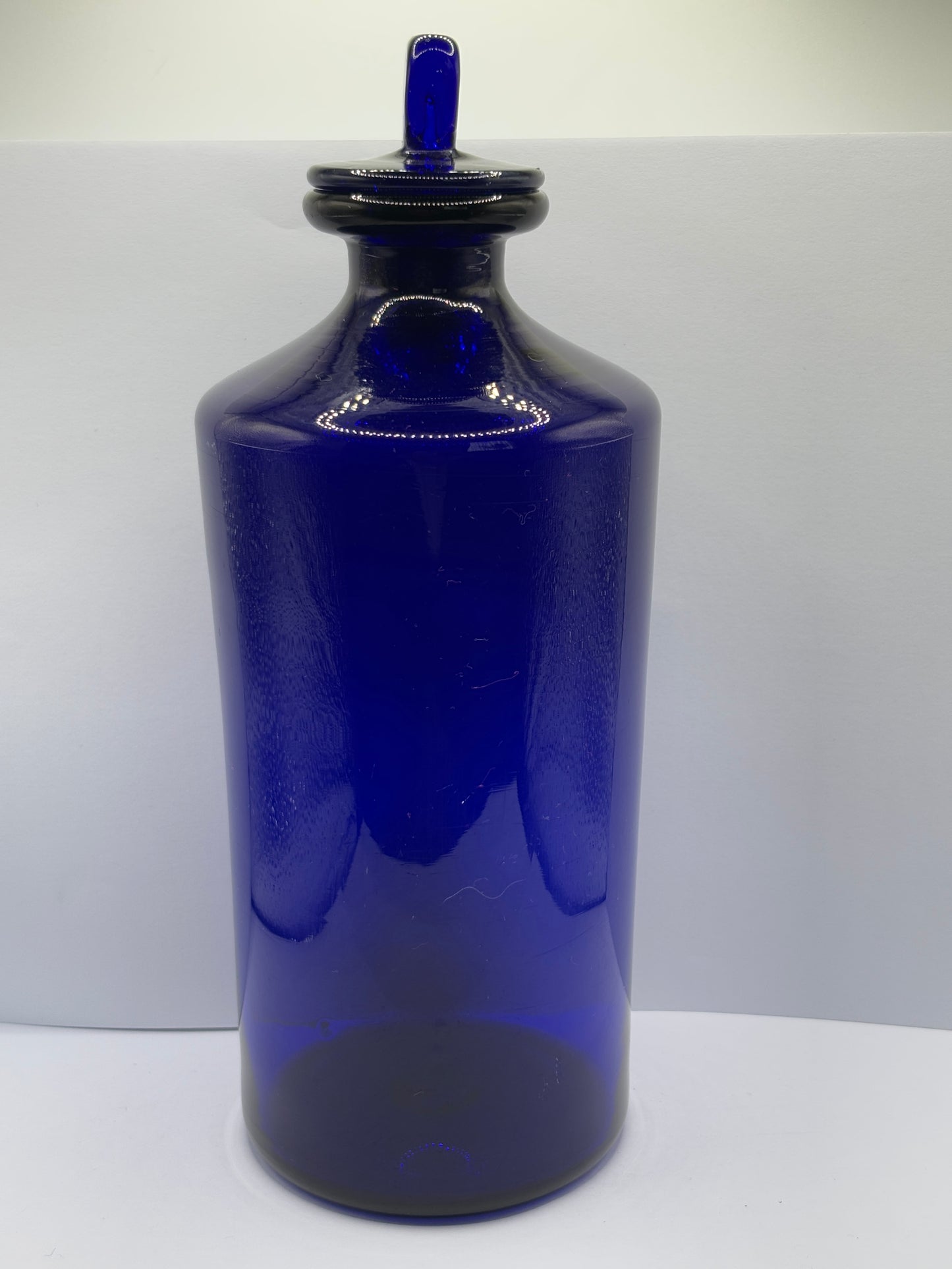 Old pontilled blue glass chemist jar, chemist round. Pharmacy