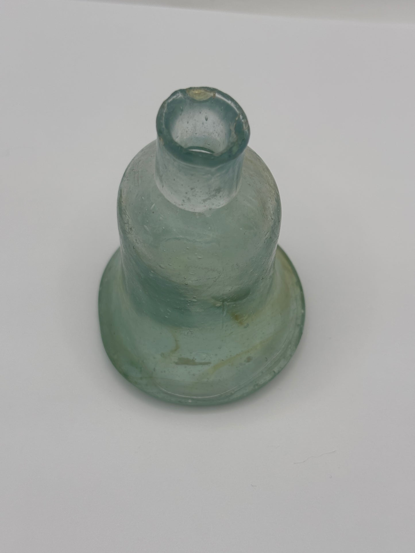 Old aqua glass inkwell, Bell ink. Swirly 7cms