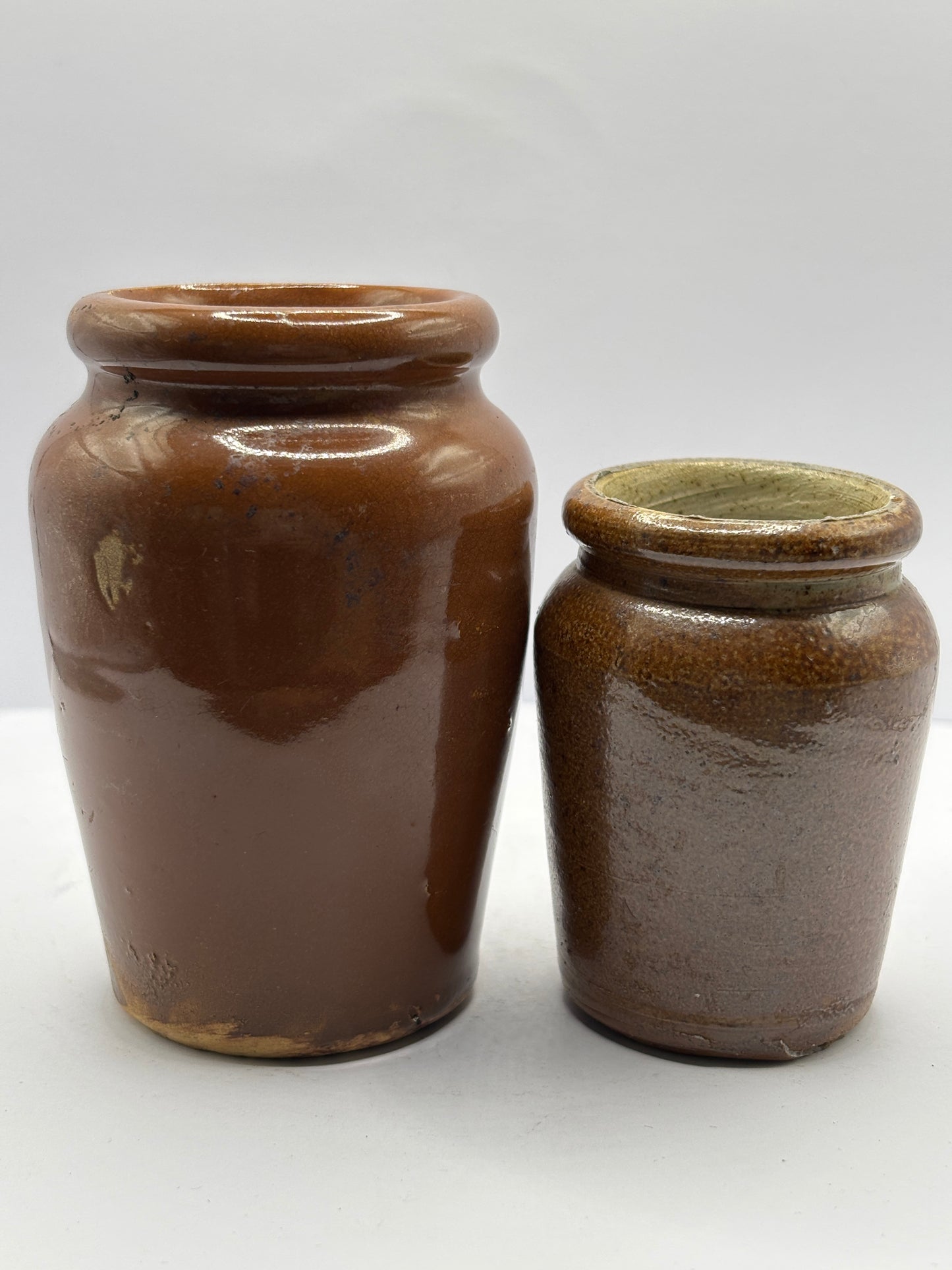 2 old brown stoneware cream pots