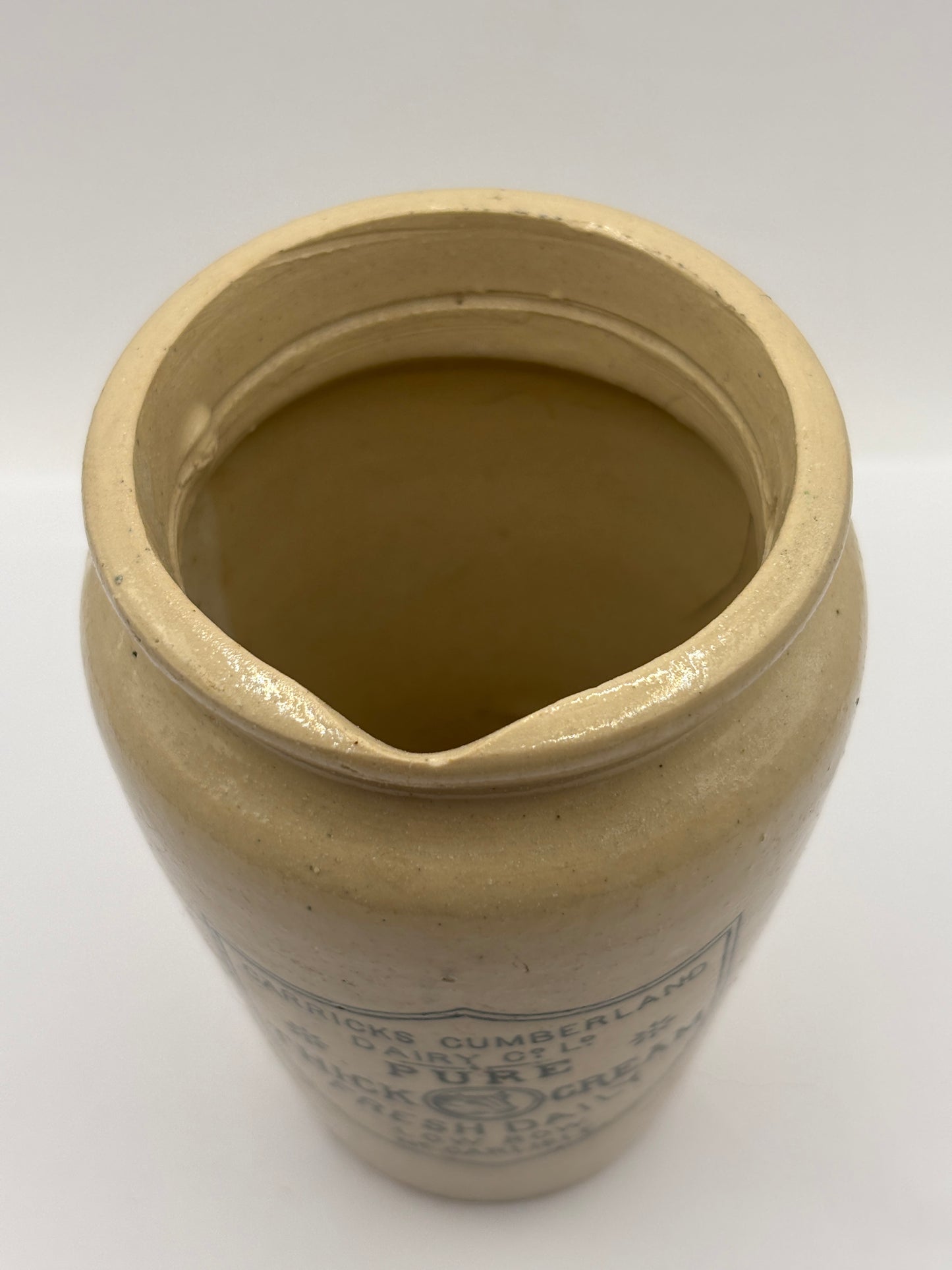 Old large advertising cream pot, Carricks pure thick cream with handle. Black print 11.5cms