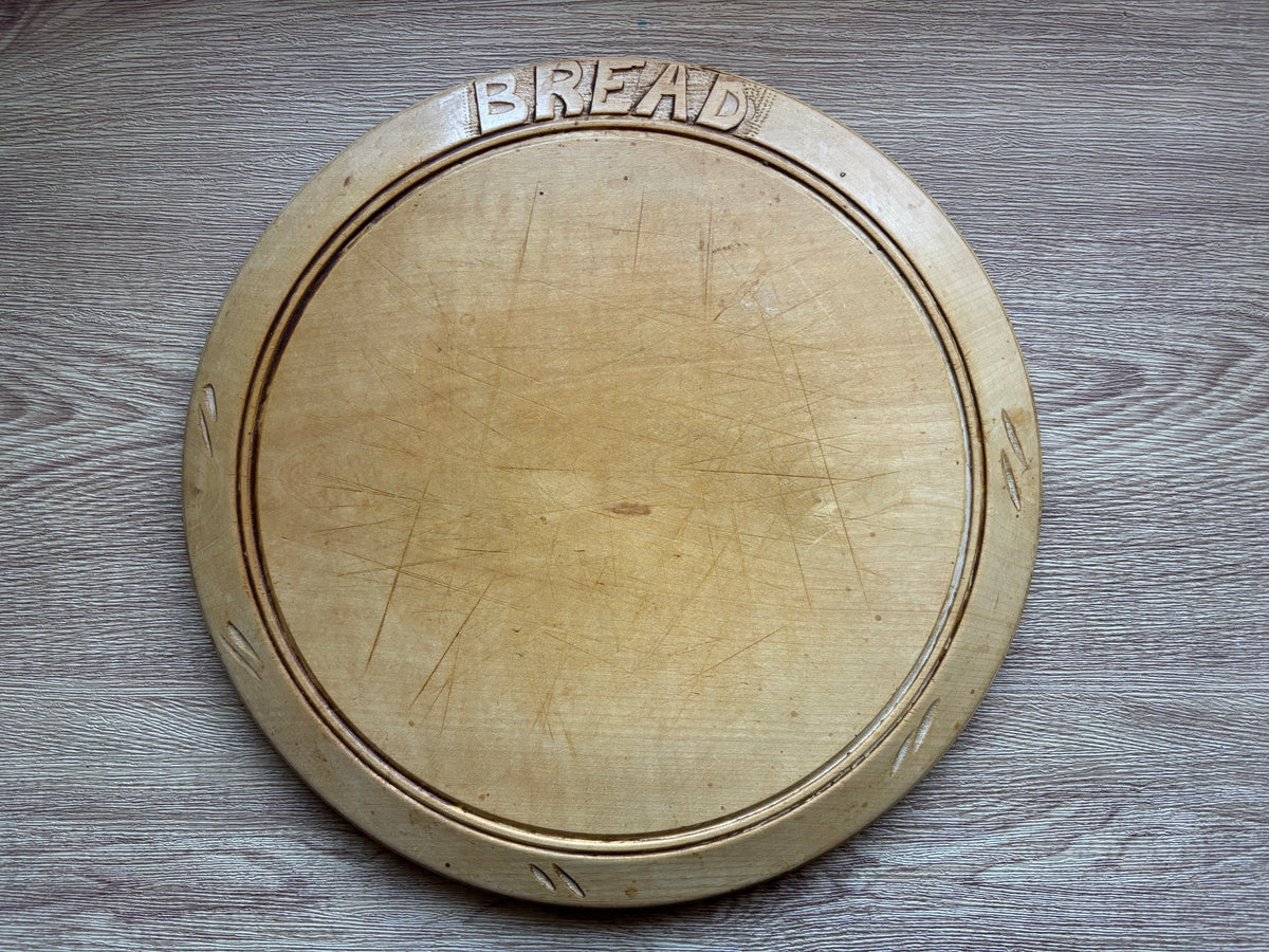 Old wooden carved bread board