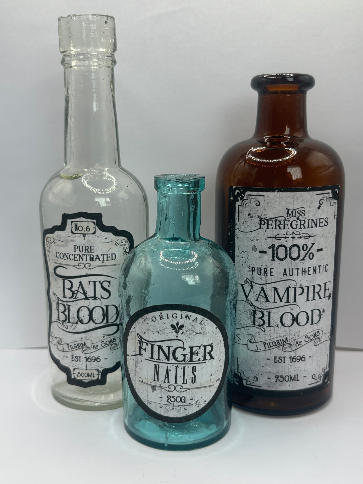 3 labelled halloween bottles