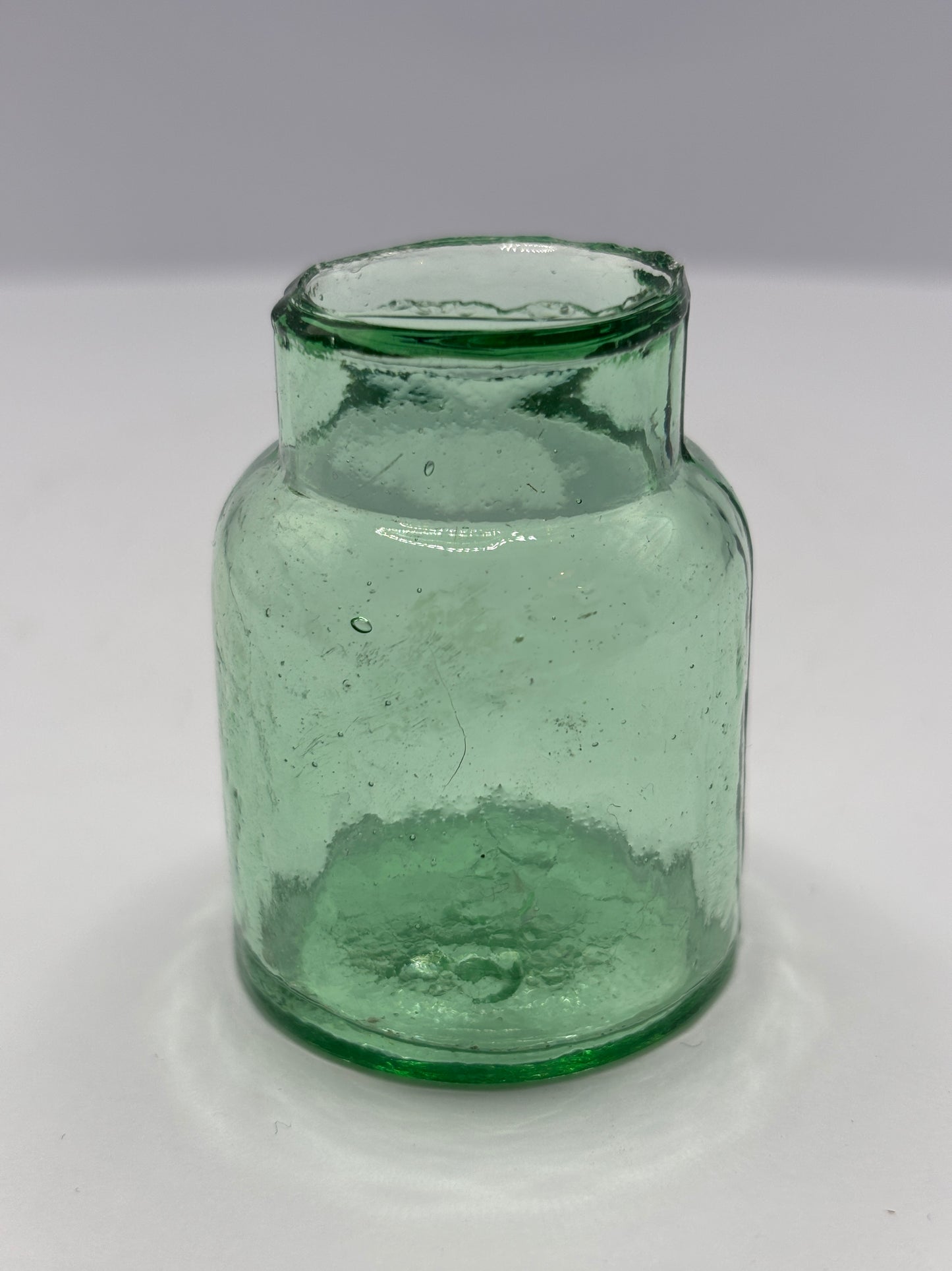Old aqua glass rat paste bottle
