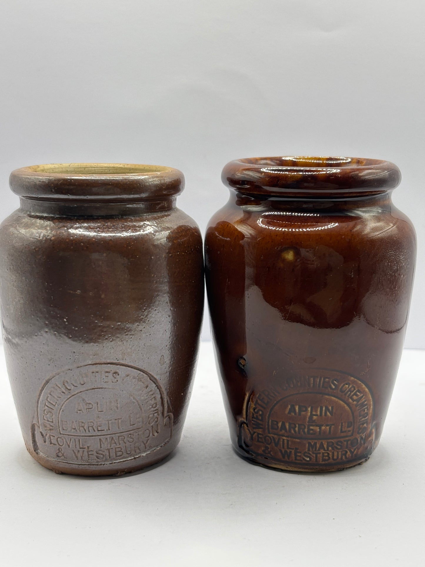 2 old brown stoneware cream pots, west counties creameries