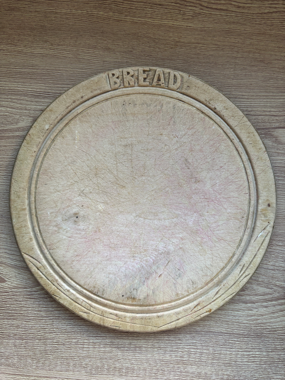 Old wooden carved bread board