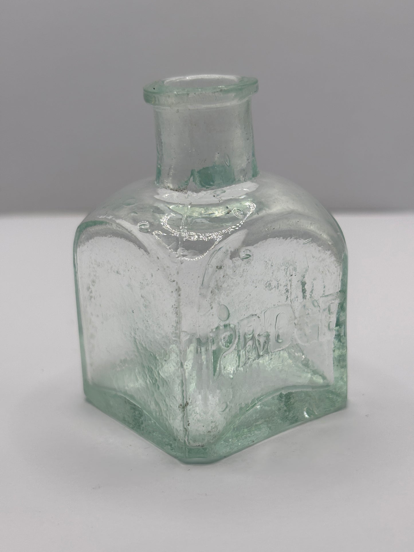 Old aqua glass advertising inkwell, ink bottle. Pridge