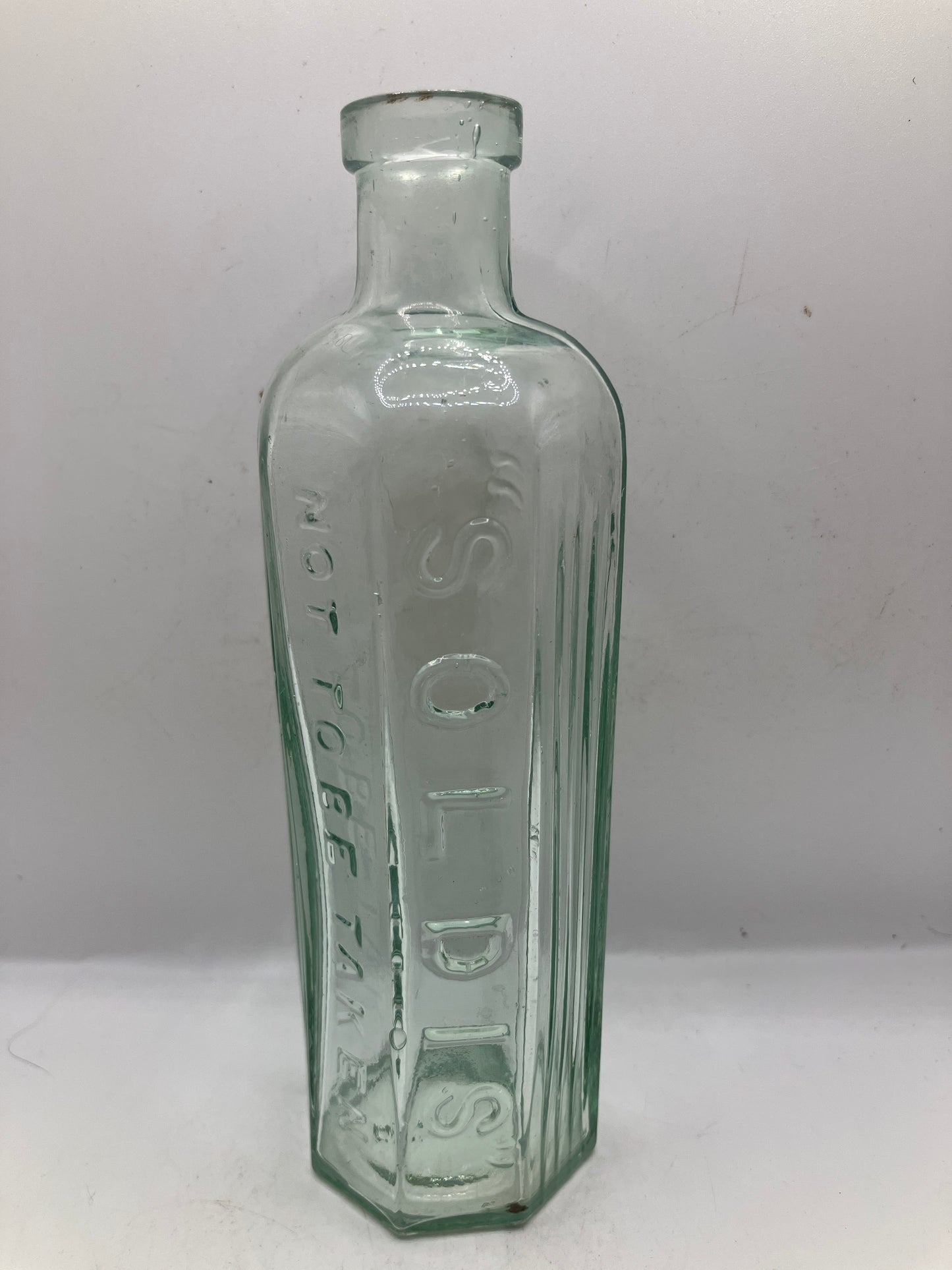 Soldis ribbed poison bottle, not to be taken