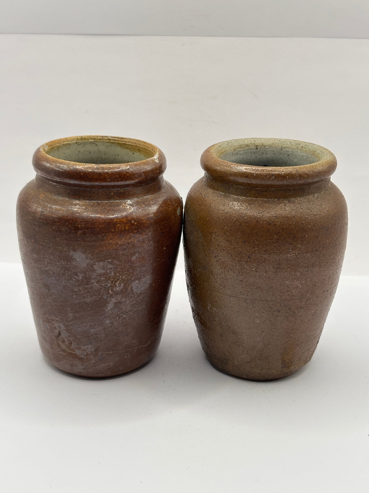2 old brown stoneware cream pots