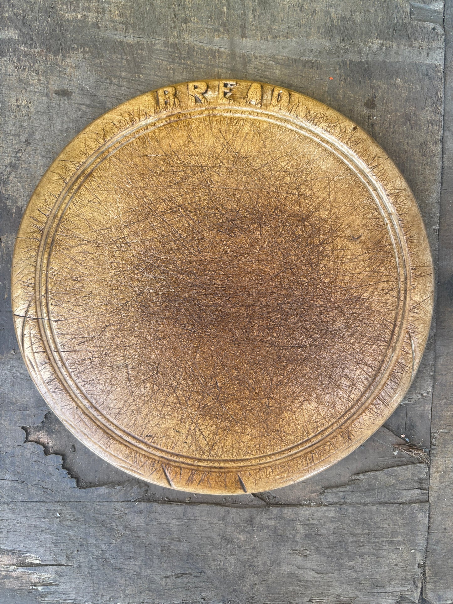 Old wooden carved bread board