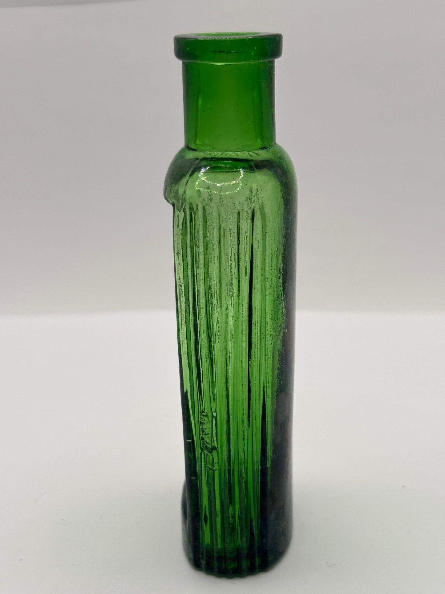 Old green glass advertising bottle. Boots Cash Chemists
