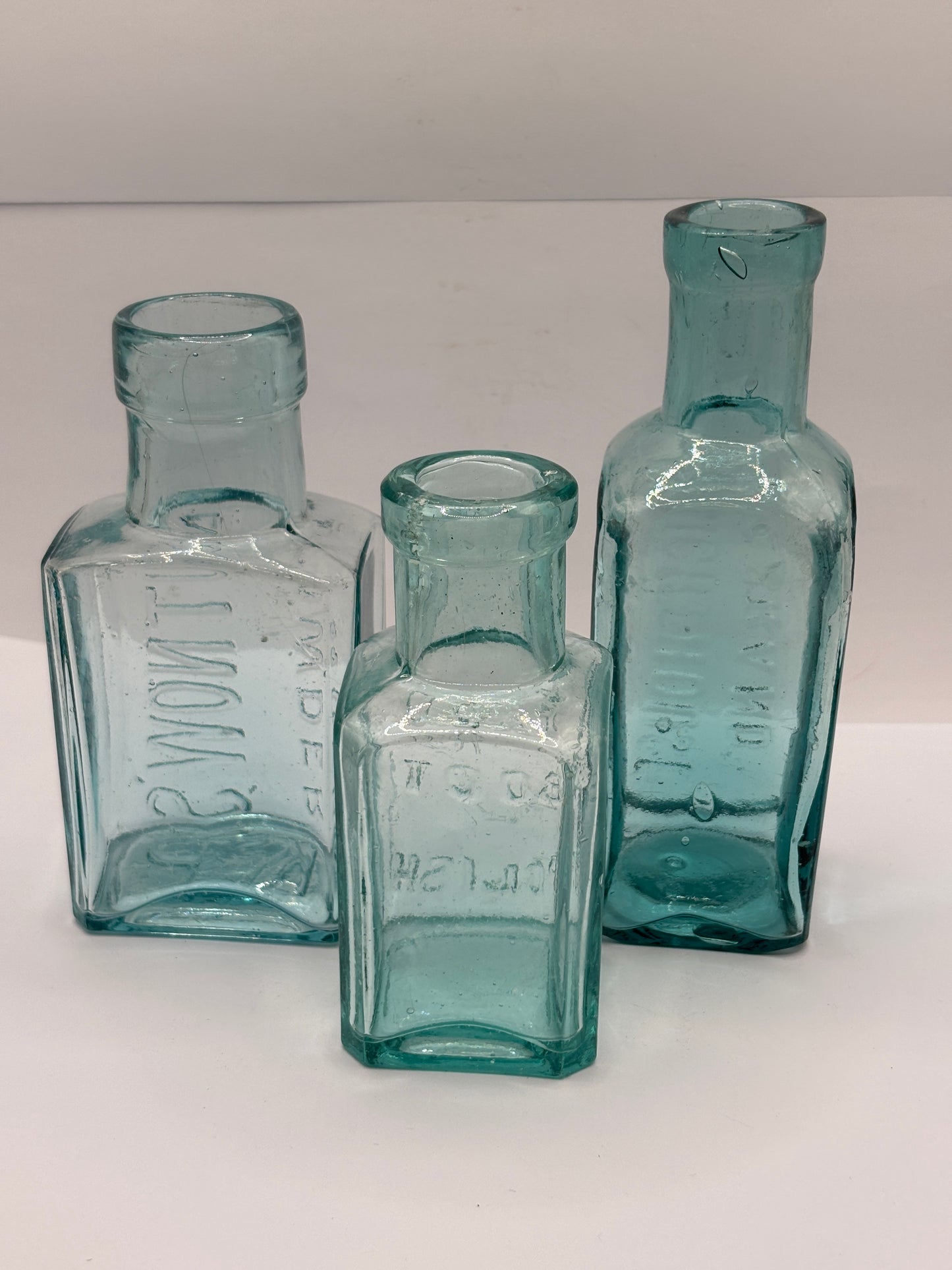 3 old aqua glass advertising chemist bottles