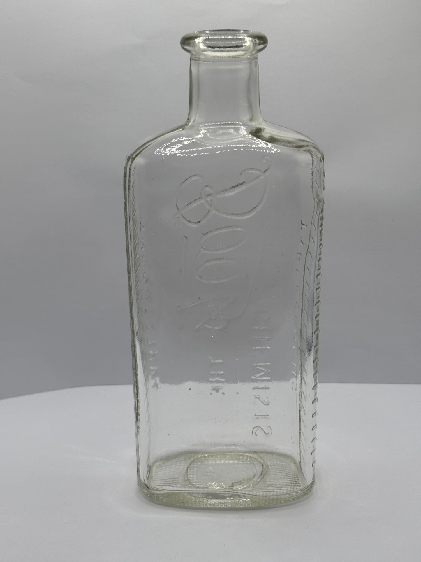 Old clear glass Boots chemist bottle