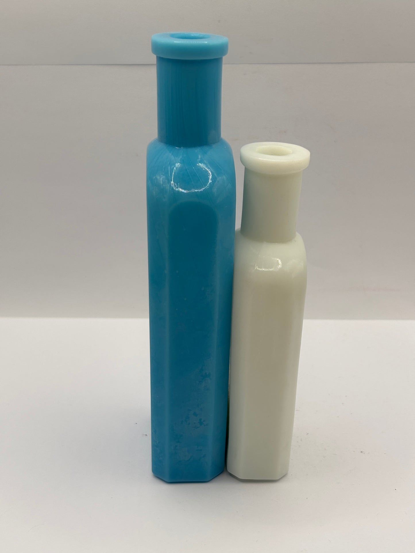 2 old milk glass bottles