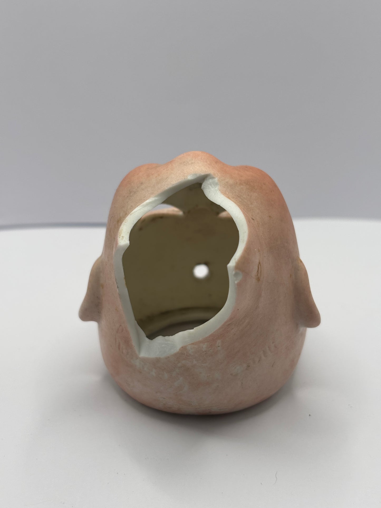 Old dolls head, damaged