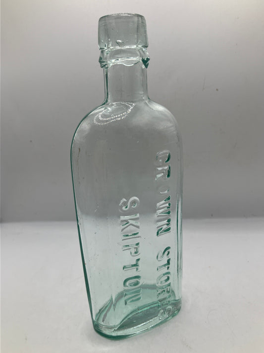 Aqua glass advertising spirit flask, Skipton