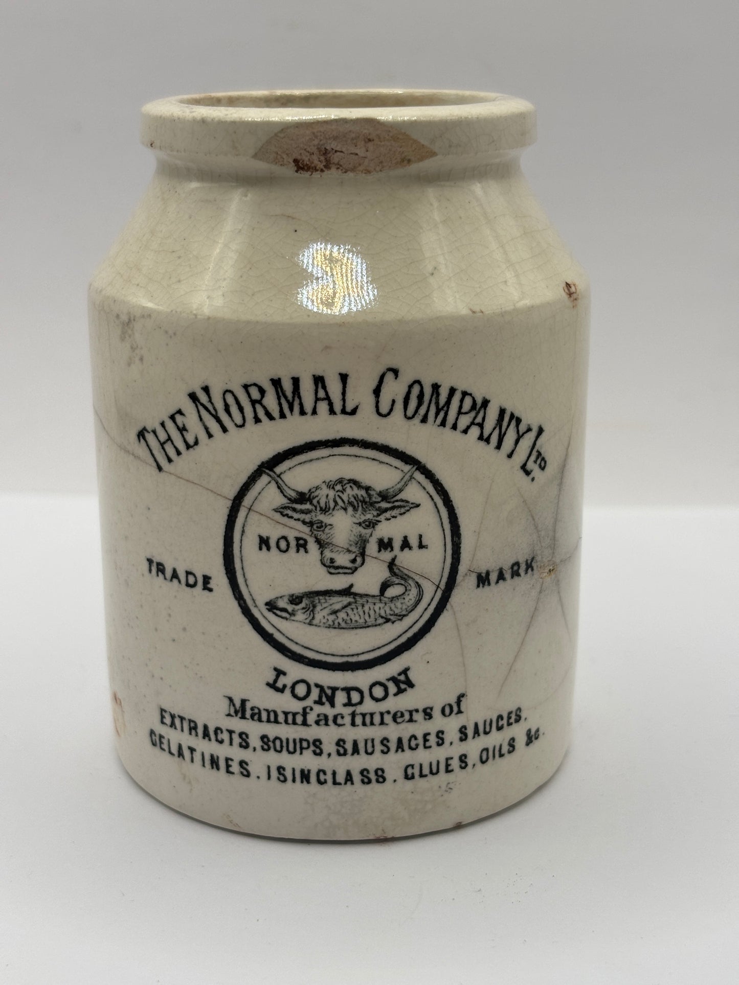 Old advertising jar, The normal company, London. Damaged