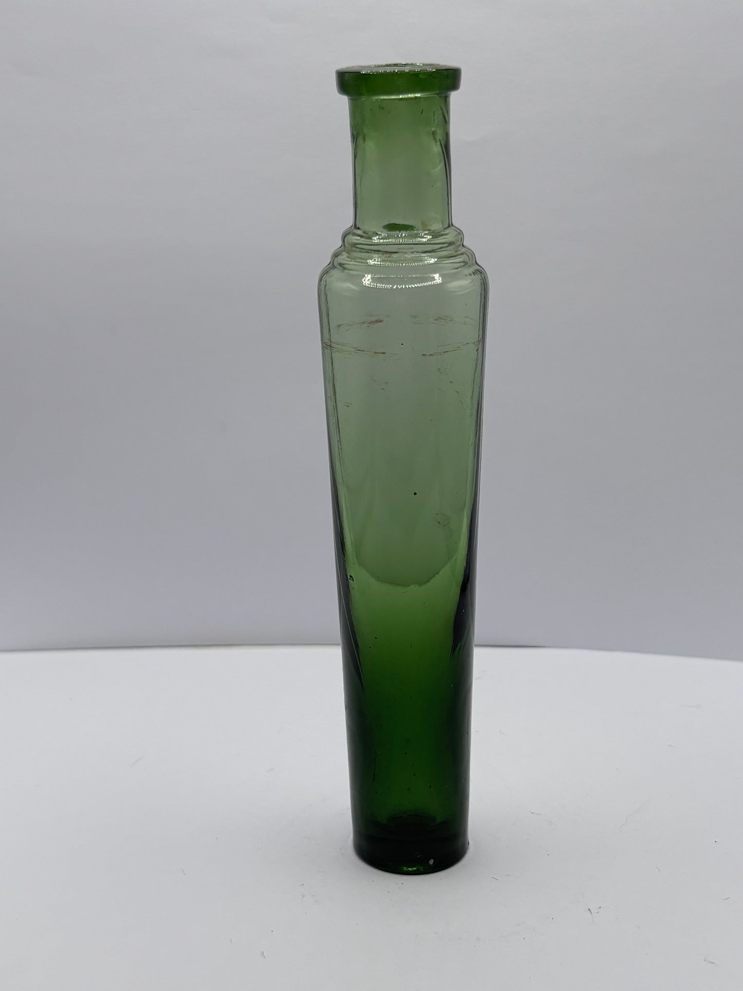 Old green glass tall lavendar water bottle