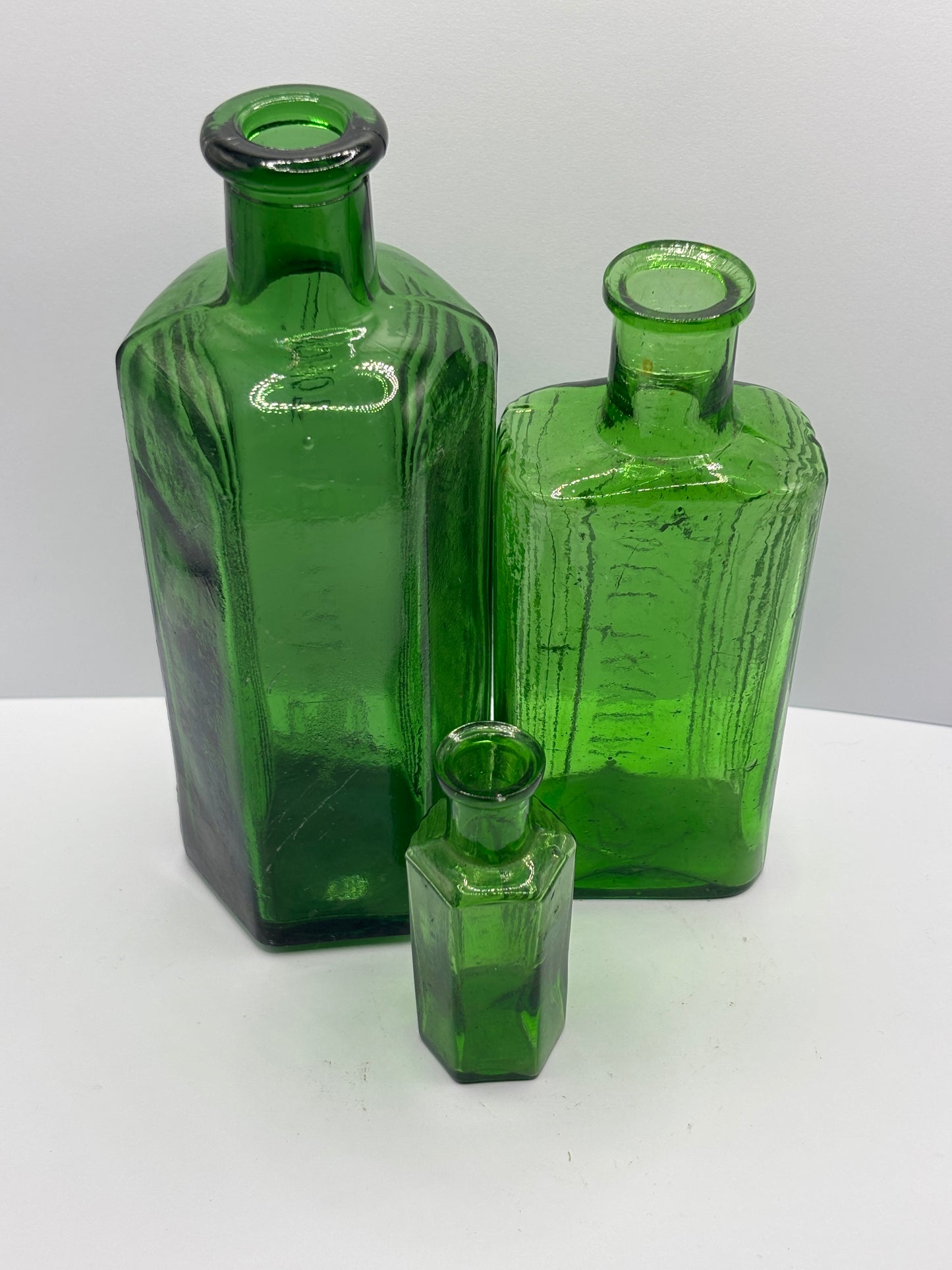 3 old green glass poison bottles, not to be taken