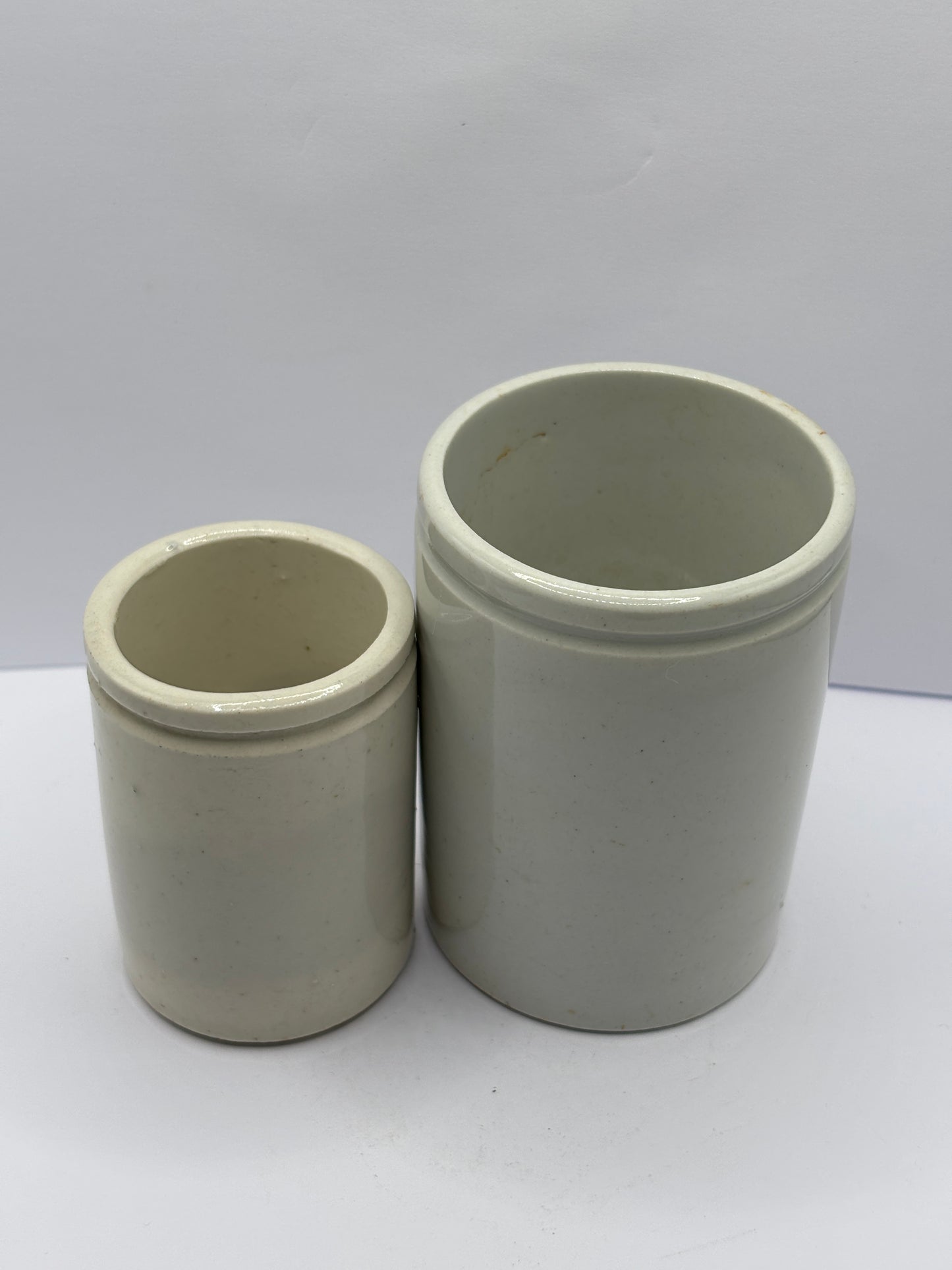 2 old white stoneware pots