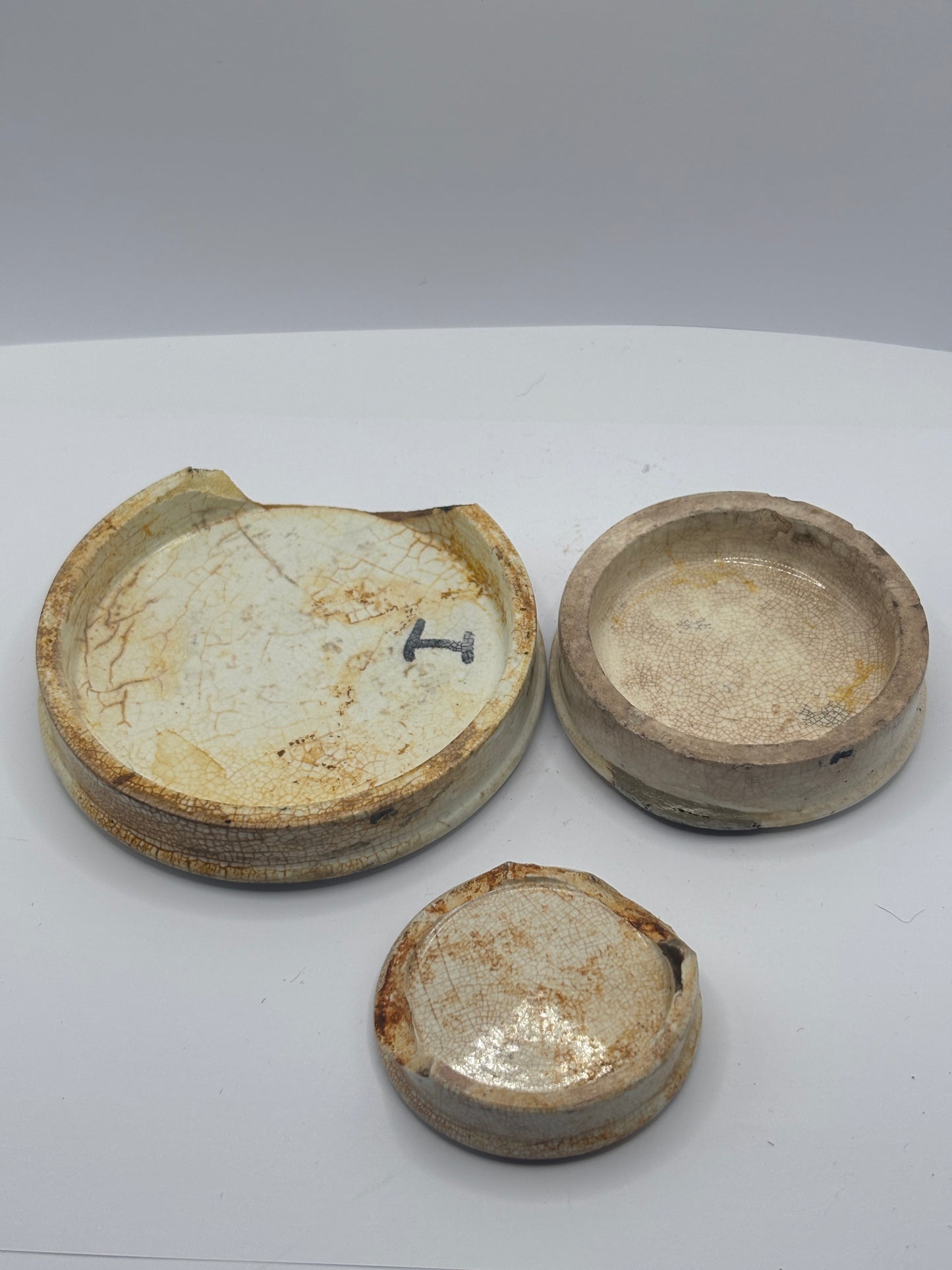 3 old damaged advertising lids